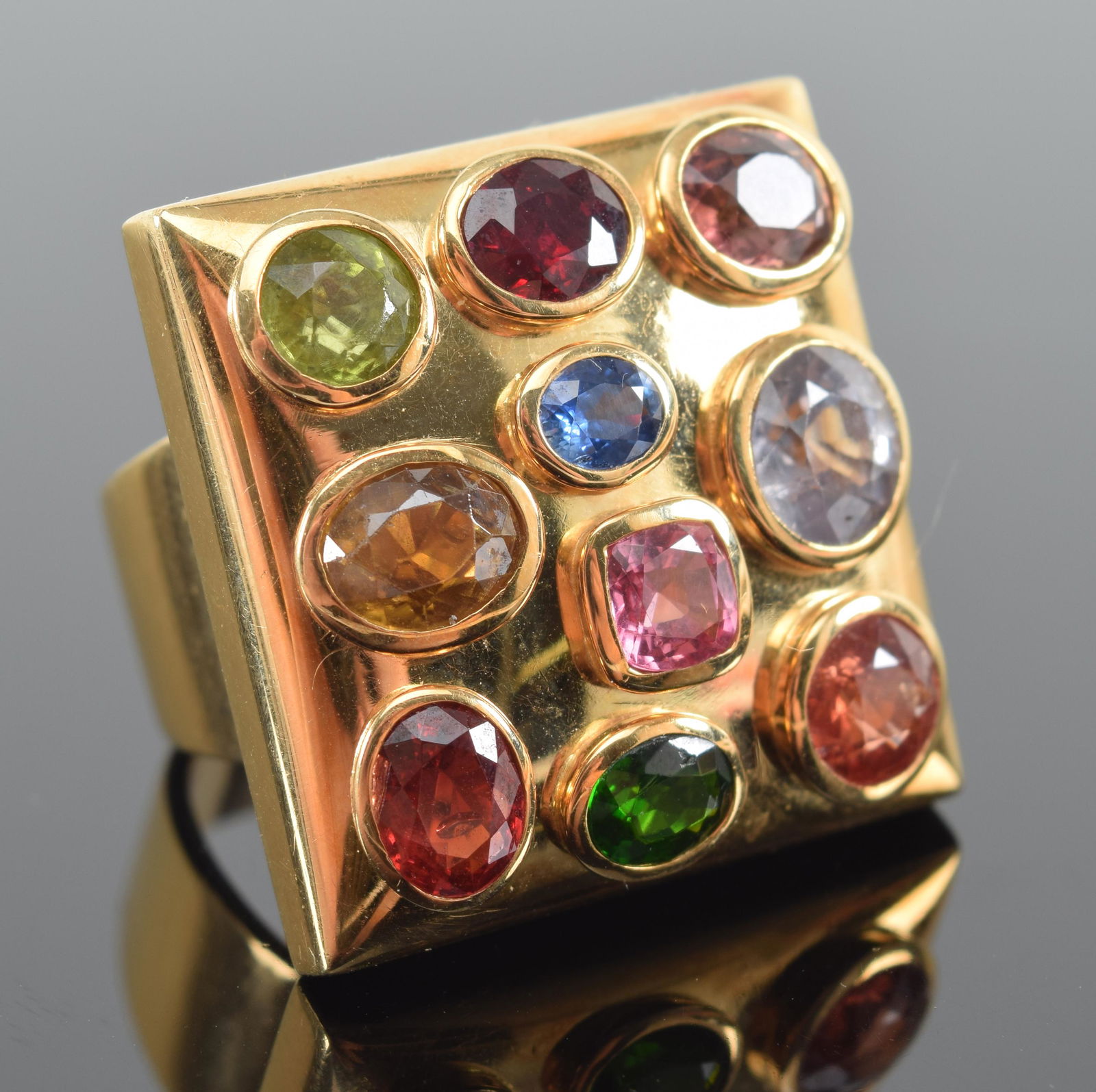 18K gold large heavy ruby, tourmaline, and topaz mounted square ring. 1in square. Marked 750. Approx (1 of 7)