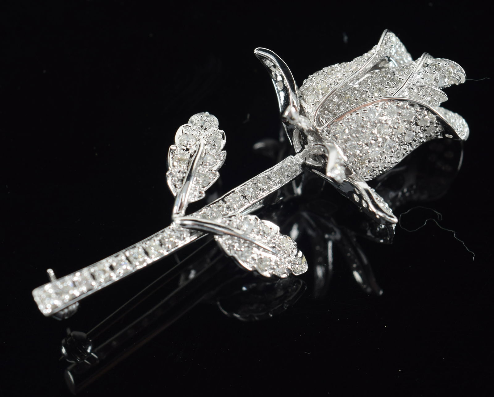 14K diamond mounted flower form white gold pin. Allover multiple diamond mounts. Marked 14K and 585. (1 of 7)