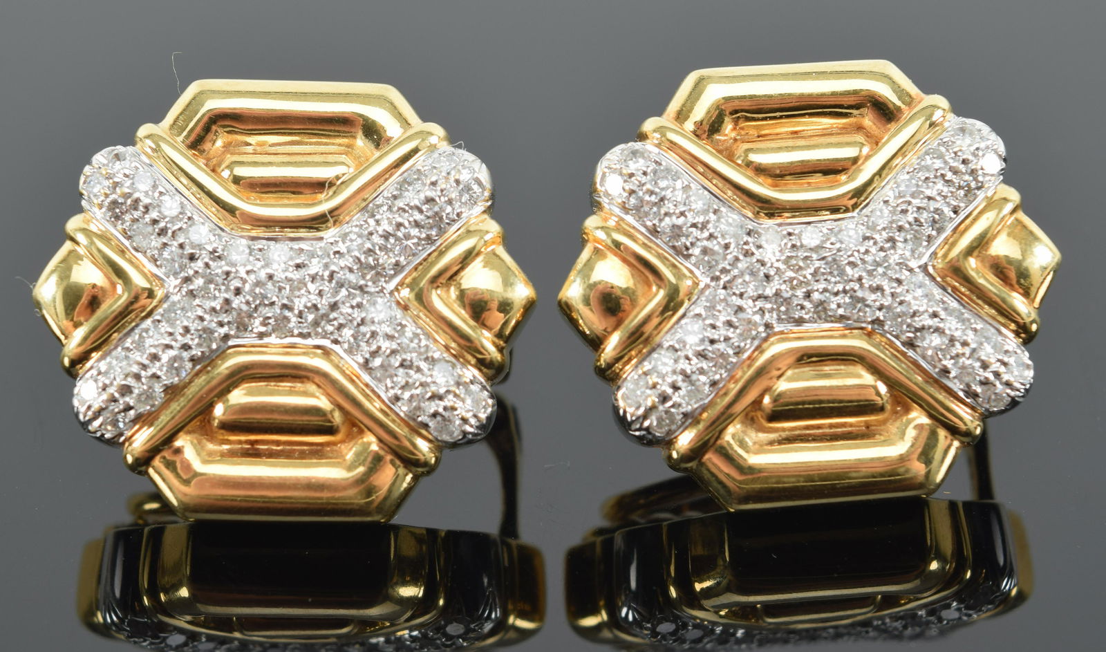 18K gold diamond mounted earrings. Bow pattern diamonds. 7/8in wide. Marked 750. 18.2 grams. (1 of 5)