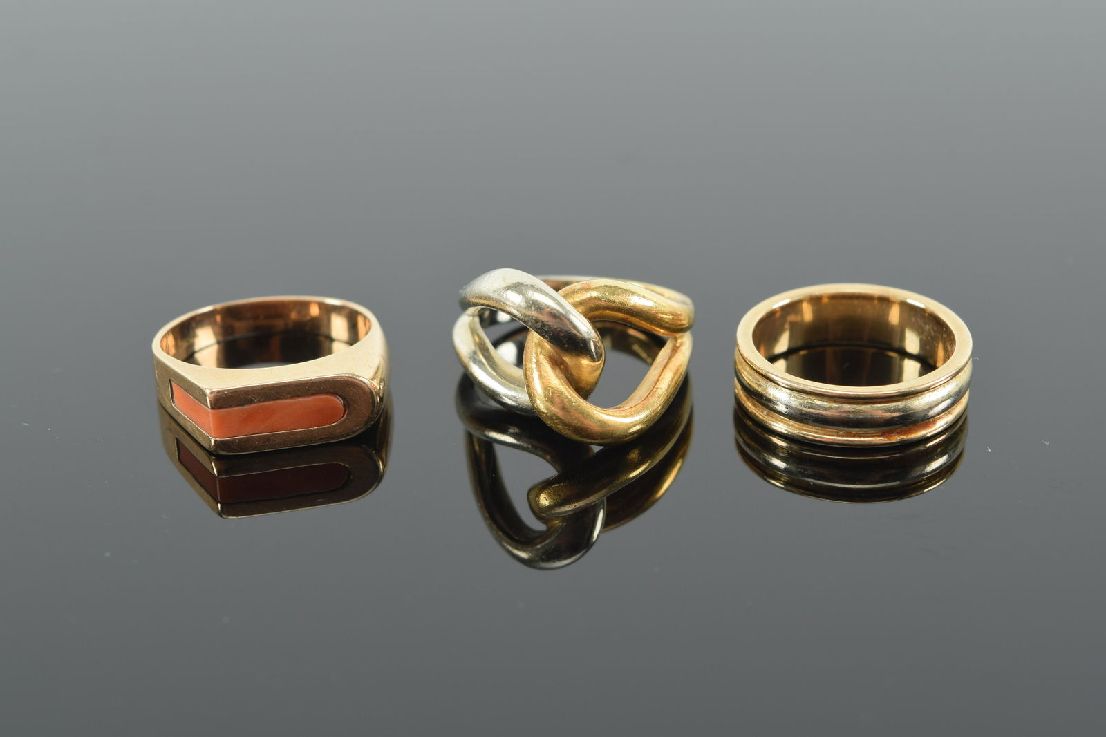 3 gold rings. 1) 18K Italy interlaced ring. 2) 14K .585 marked rectangular cut corner ring. 3) 14K (1 of 6)