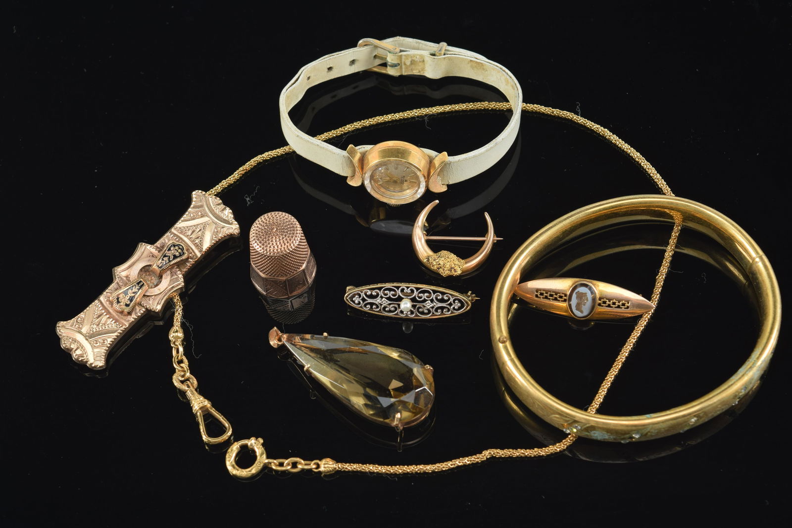 Lot of 9 items. 1) Marked .750 18K gold ladies wristwatch. Bucherer 17 jewel. 2) 14K gold thimble. (1 of 10)