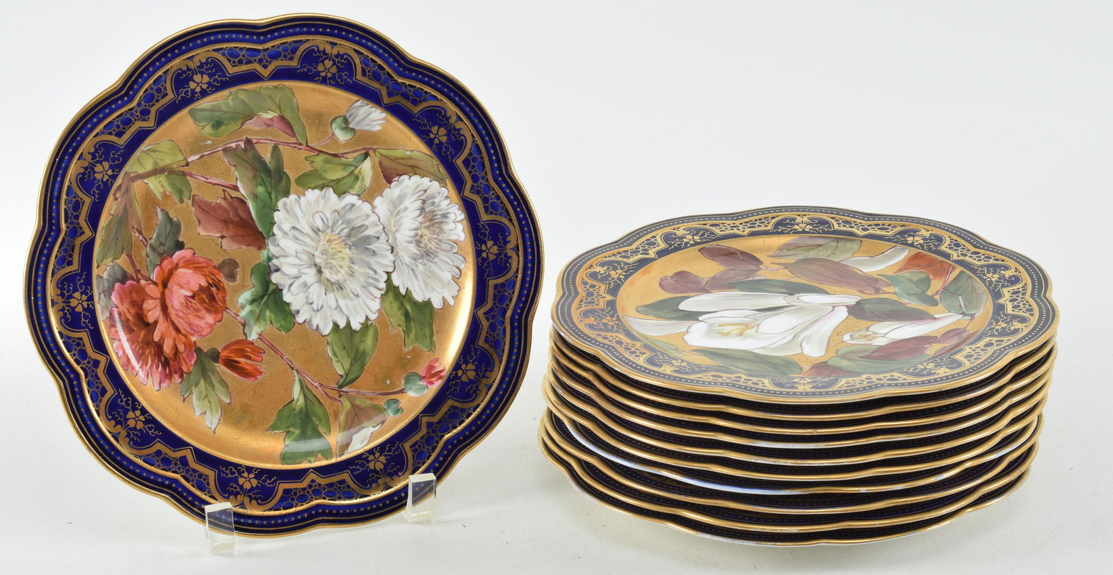 Set of 11 Wedgwood floral decorated plates signed F. Dean. Gilt and cobalt borders around hand (1 of 9)