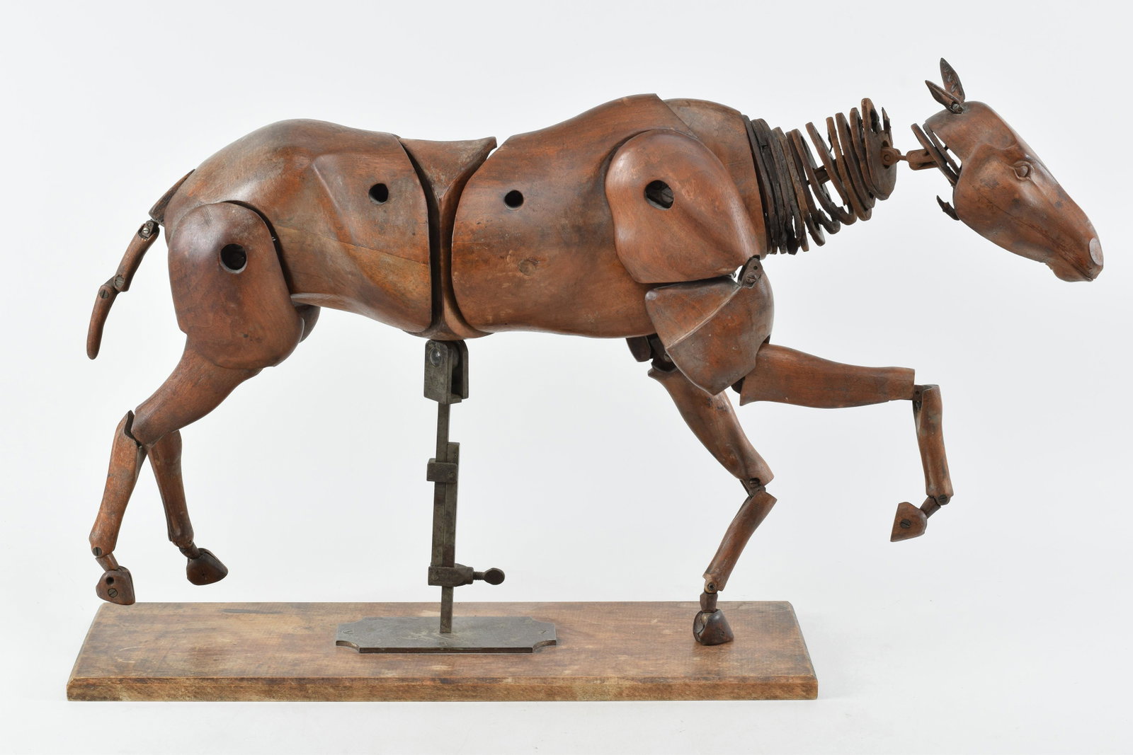 Articulated carved walnut and steel horse form artist model, late 19th Century. Fully articulated: Articulated carved walnut and steel horse form artist model, late 19th Century. Fully articulated artist model with steel ball joints and leather spacers at neck. Nice old surface. Height at center 18
