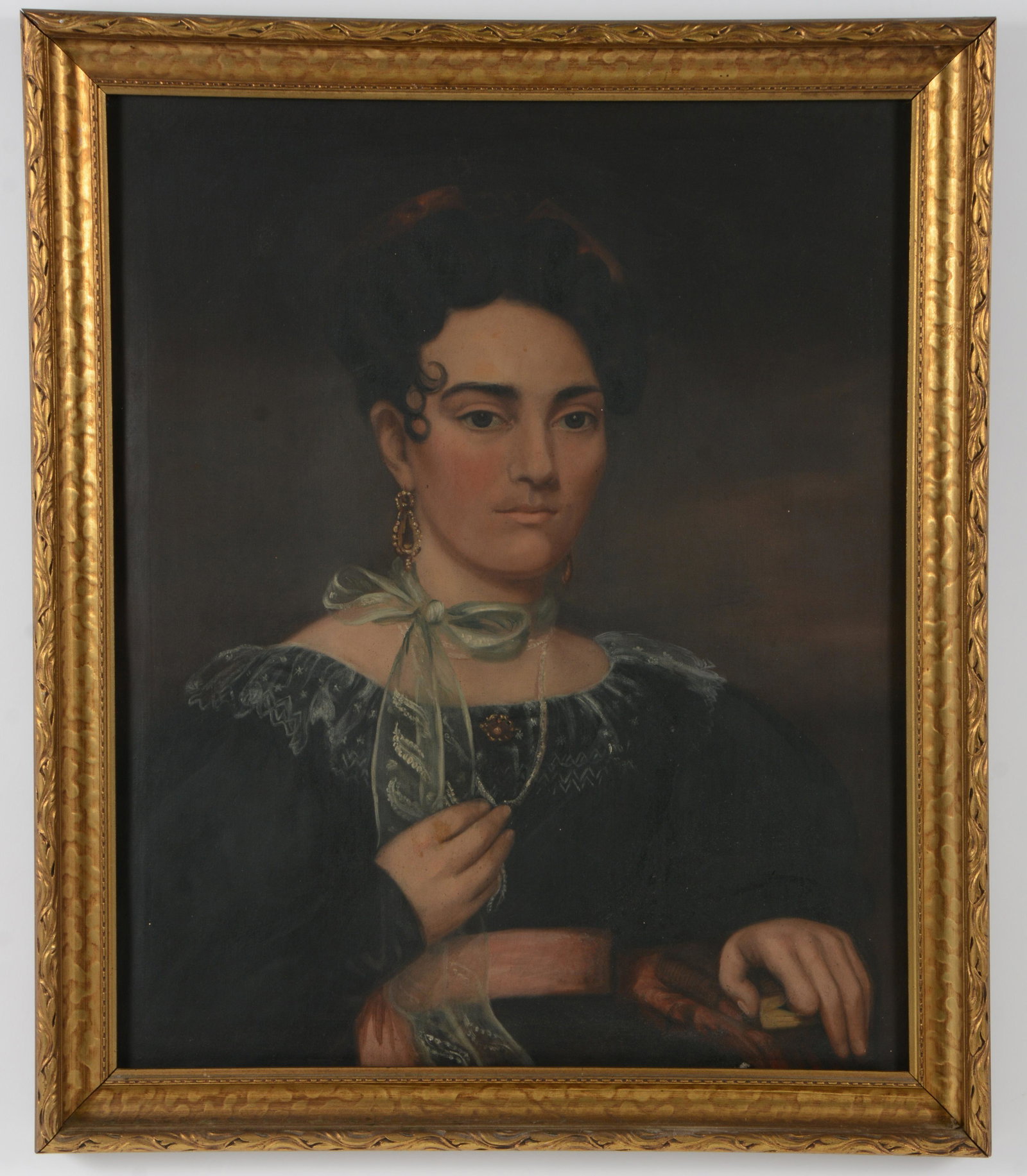 American school early 19th century portrait of a young woman wearing black lace dress and ribbon: American school early 19th century portrait of a young woman wearing black lace dress and ribbon around her neck. Seated holding a book. Ca. 1830. Oil on canvas. Later frame. Sight: 28 x 24.25in. Over