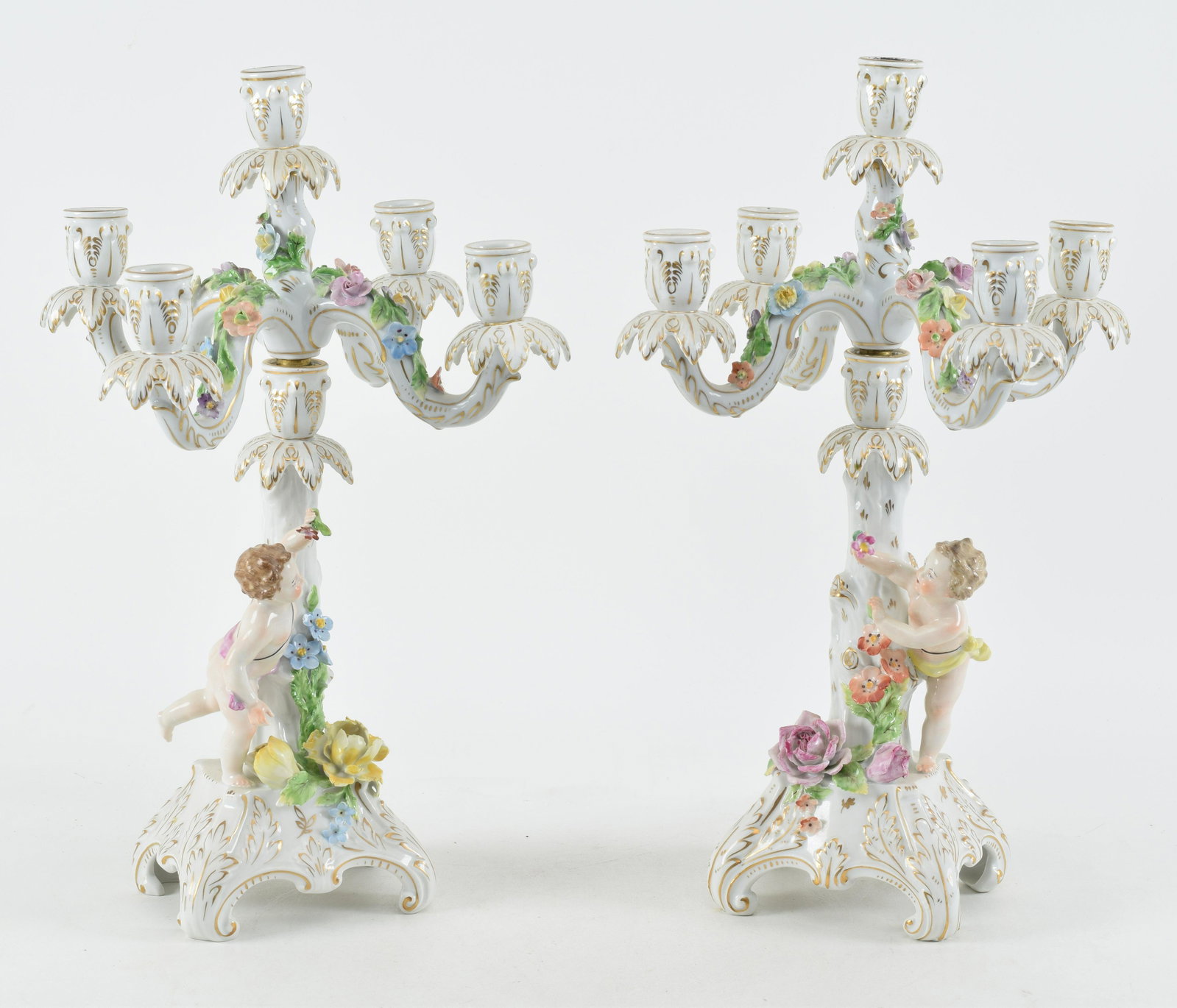 Pair of Dresden five light candelabra with putti and floral decorations. Height 18.5 in.: Pair of Dresden five light candelabra with putti and floral decorations. Height 18.5 in.