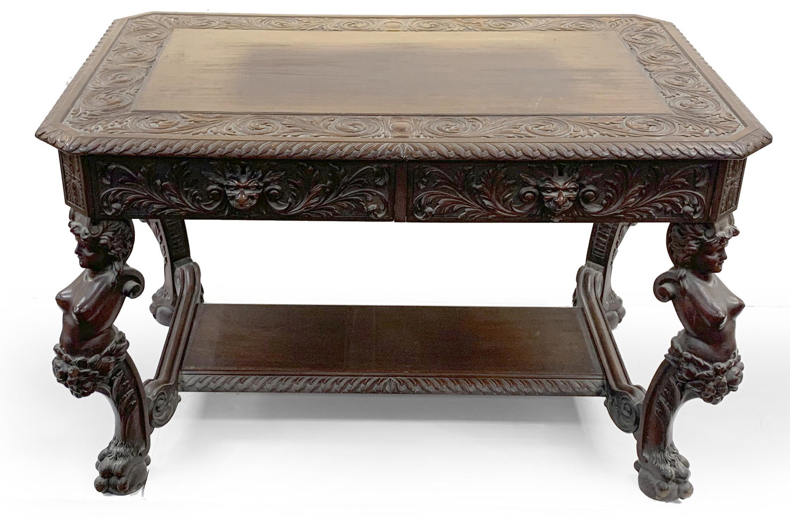 Renaissance revival carved mahogany center table, early 20th Century. Highly carved top and apron: Renaissance revival carved mahogany center table, early 20th Century. Highly carved top and apron with two sets of double drawers. The figural supports with figural nudes and paw feet. Height 30, top 