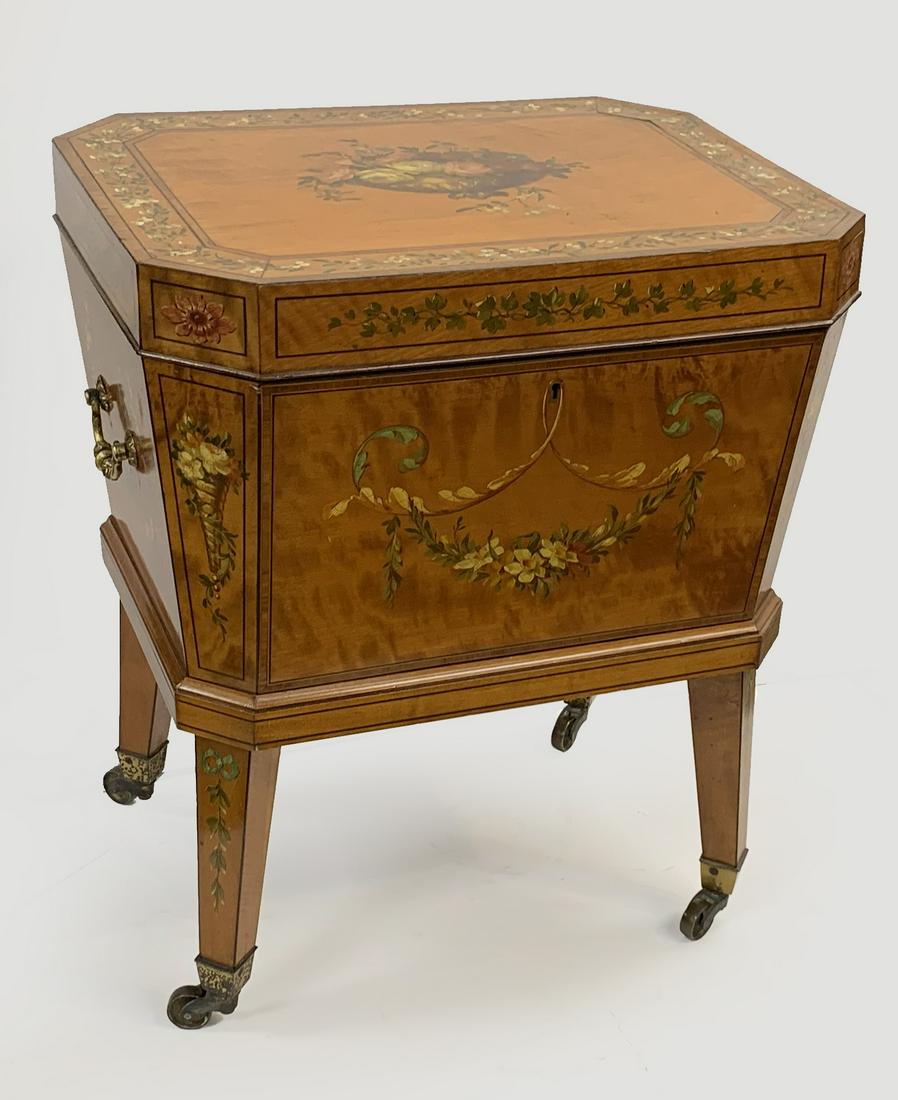 Adam style satinwood and paint decorated cellarette, 19th Century. Octagonal form with floral: Adam style satinwood and paint decorated cellarette, 19th Century. Octagonal form with floral decorations and velvet interior on square tapered legs. Height 22.5in