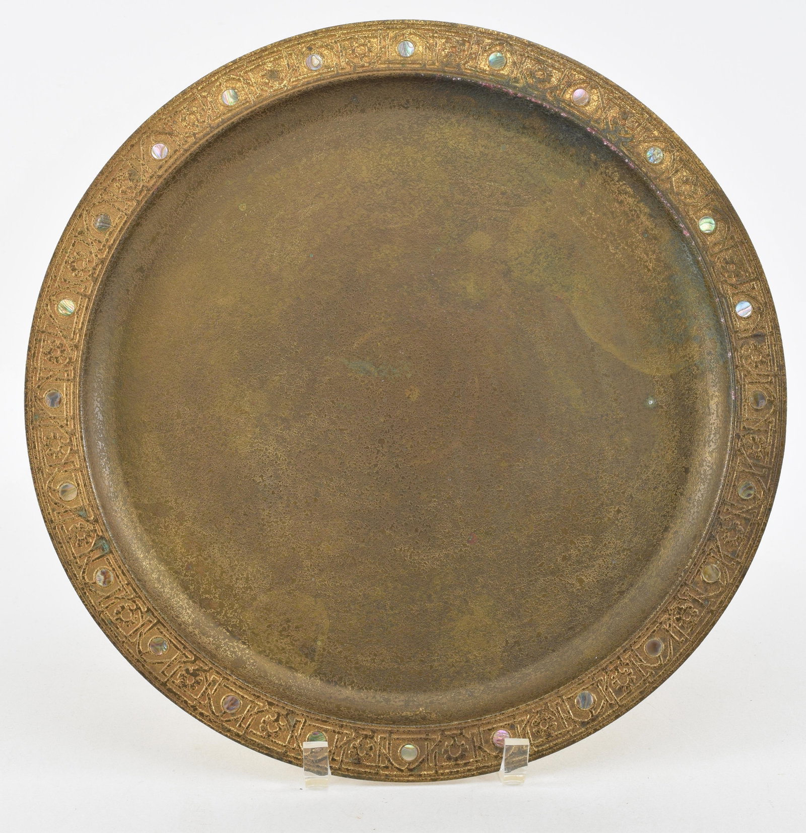 Tiffany Studios, Dore round tray with mother of pearl inlaid. Marked at rim 1728. Diameter 14 in.: Tiffany Studios, Dore round tray with mother of pearl inlaid. Marked at rim 1728. Diameter 14 in. Some loss to patina at center