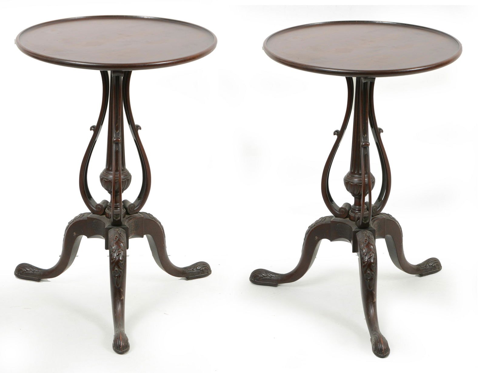 Pair of Colonial revival mahogany tea tables. Dished tops on fluted columns framed with cyma curved: Pair of Colonial revival mahogany tea tables. Dished tops on fluted columns framed with cyma curved brackets. All on cabriole legs with oak leaf knees and foliate slipper feet. Top 19.5 Height 28.5
