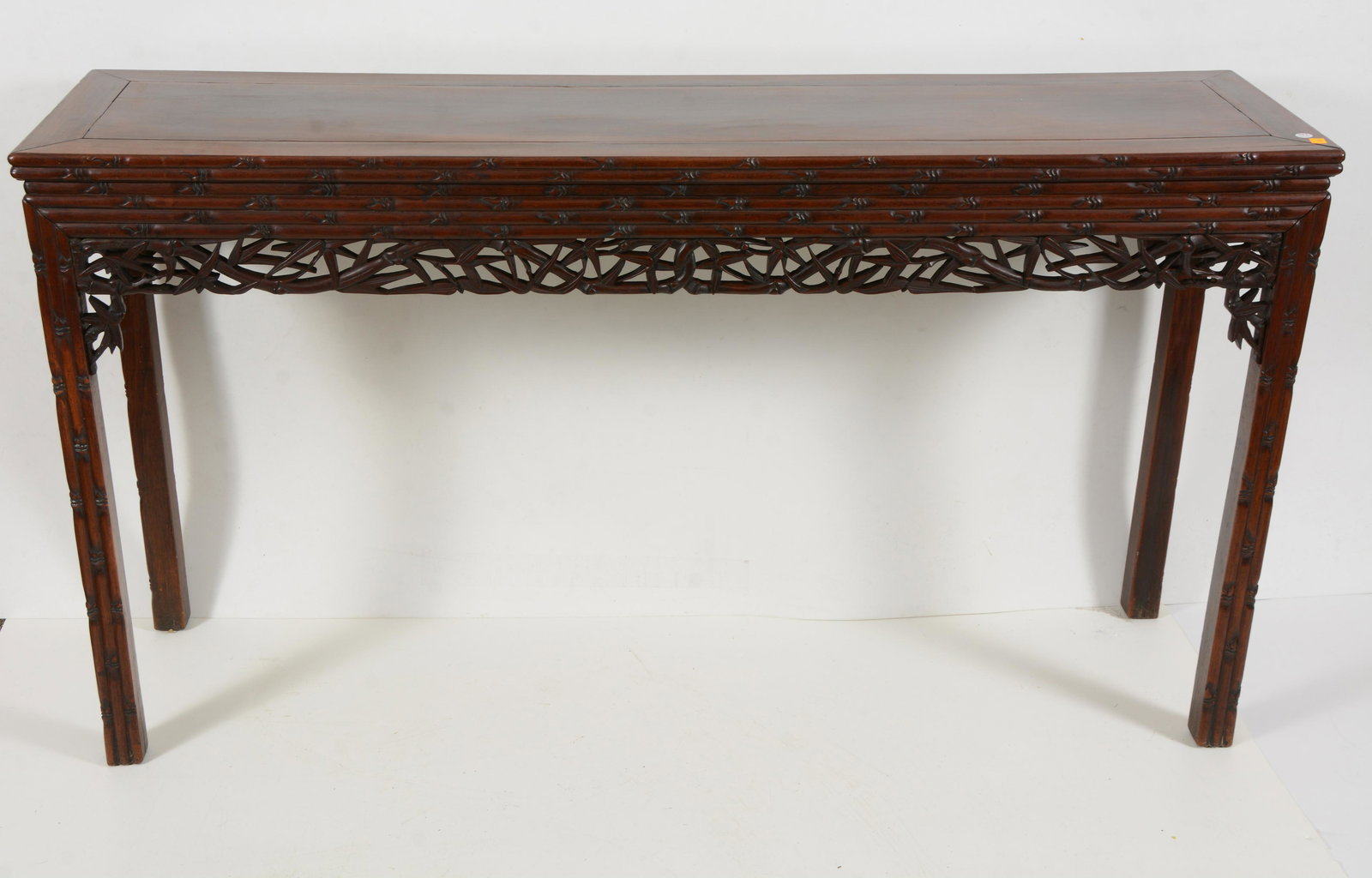 Rosewood table. China. 19th century. Surfaces carved on all sides with bamboo. 61.25 L x 15.5 D x (1 of 4)