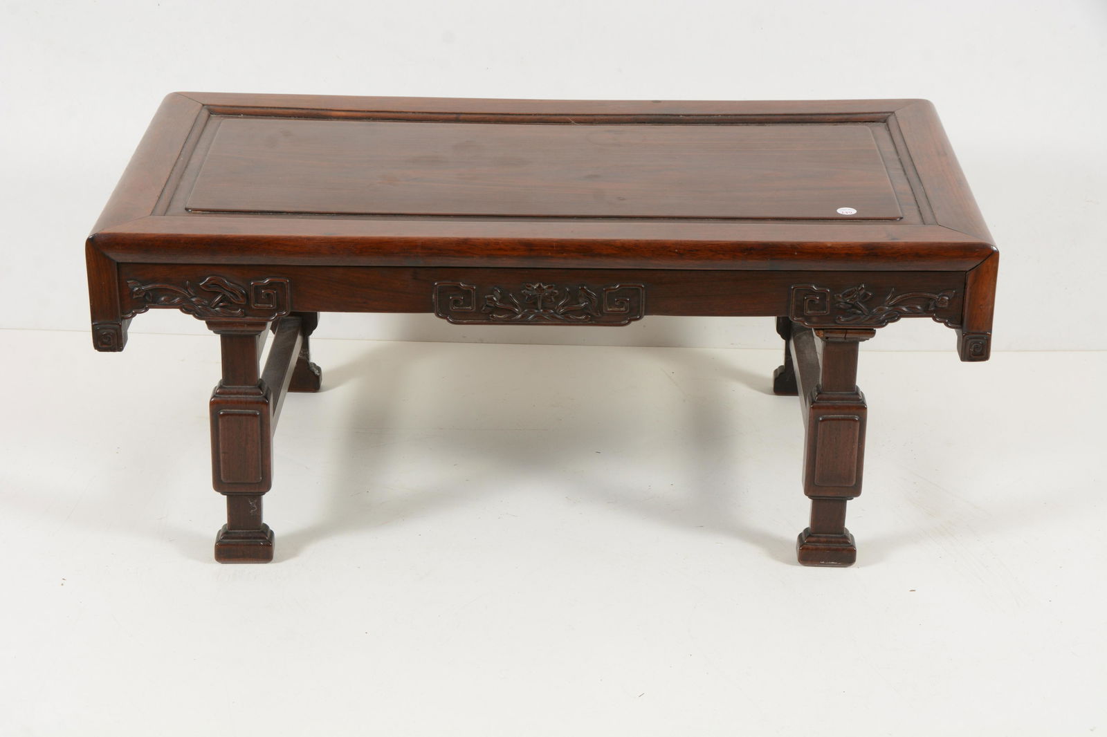Rosewood kang table. China. Early 20th century. Aprons carved with lotus flowers and archaic (1 of 5)