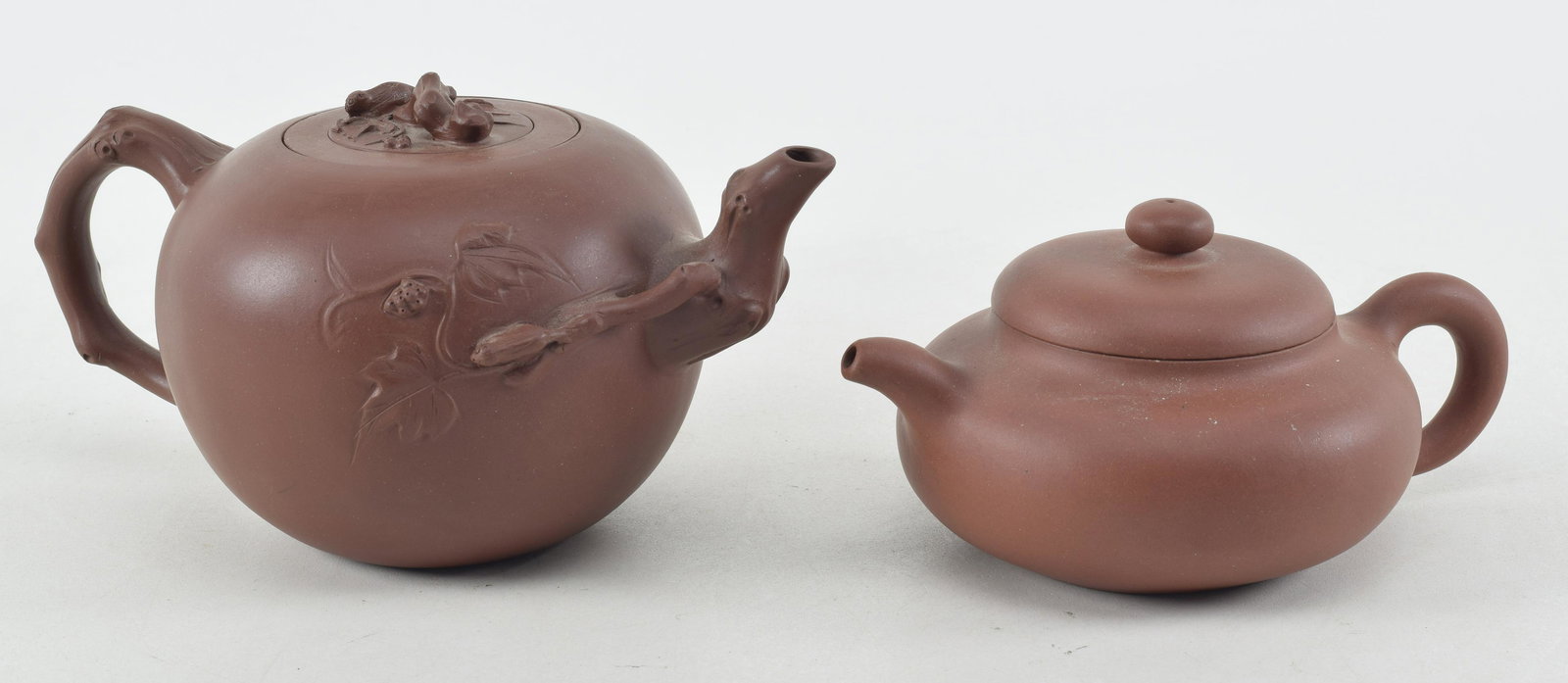 2 Chinese yixing teapots. 1) Larger teapot with grape and squirrel carved decoration. Interior (1 of 11)