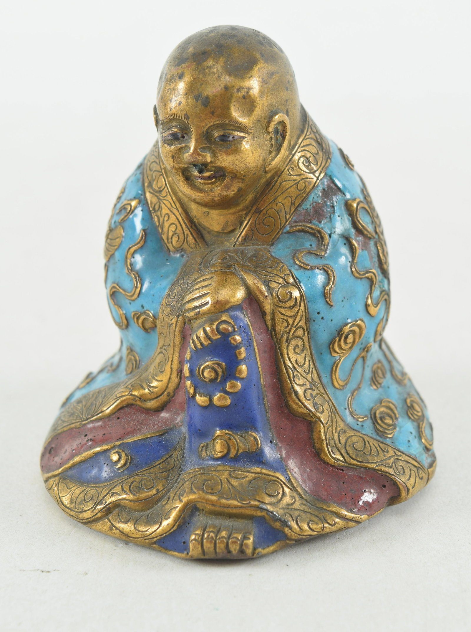 Enamel and copper repousse figure of a Buddhist monk. China. 19th century. 3in high. (1 of 5)