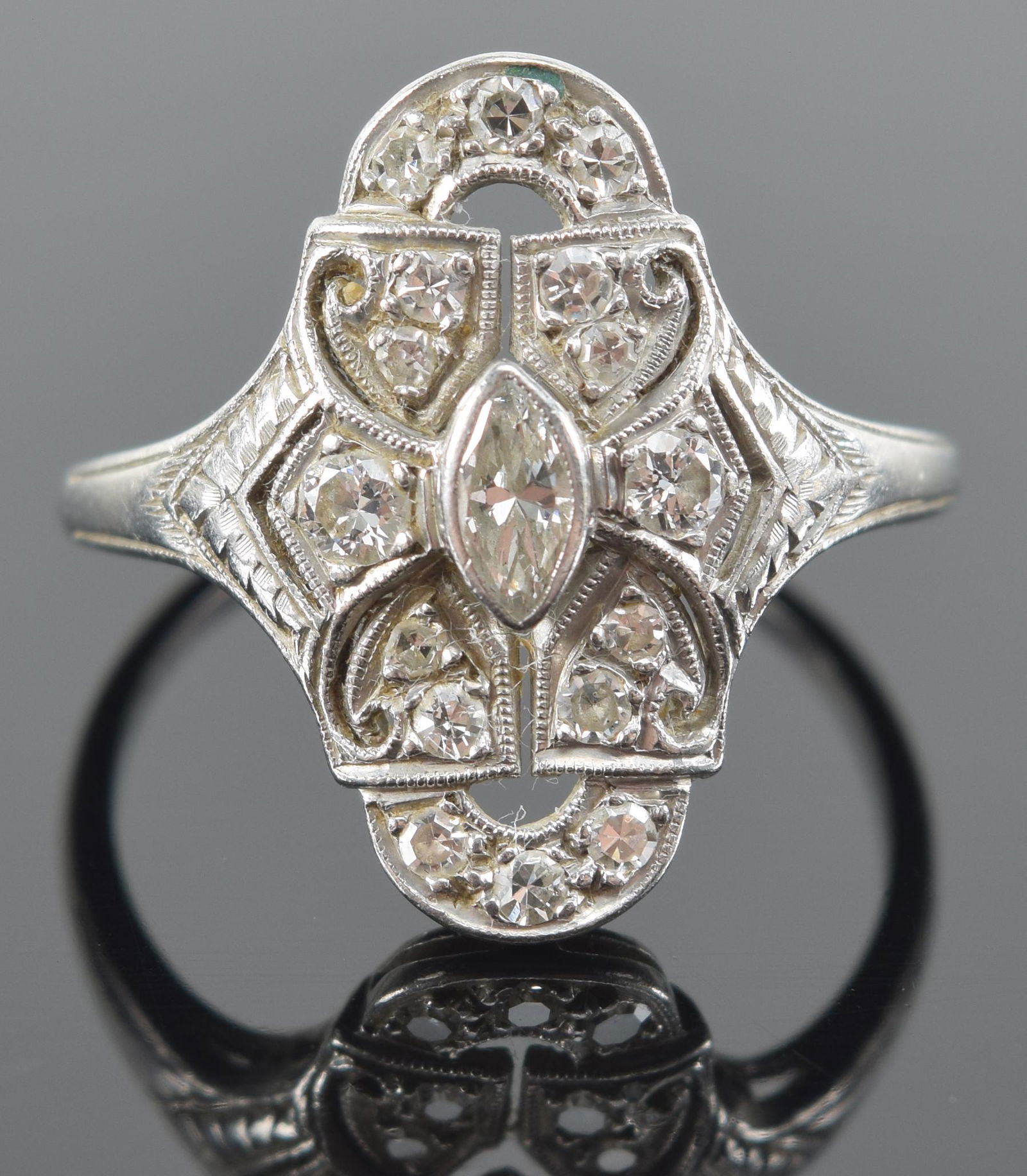 Vintage platinum and diamond mounted art deco design ring. Marked. 3.6 grams. 6.25 ring size.: Vintage platinum and diamond mounted art deco design ring. Marked. 3.6 grams. 6.25 ring size.