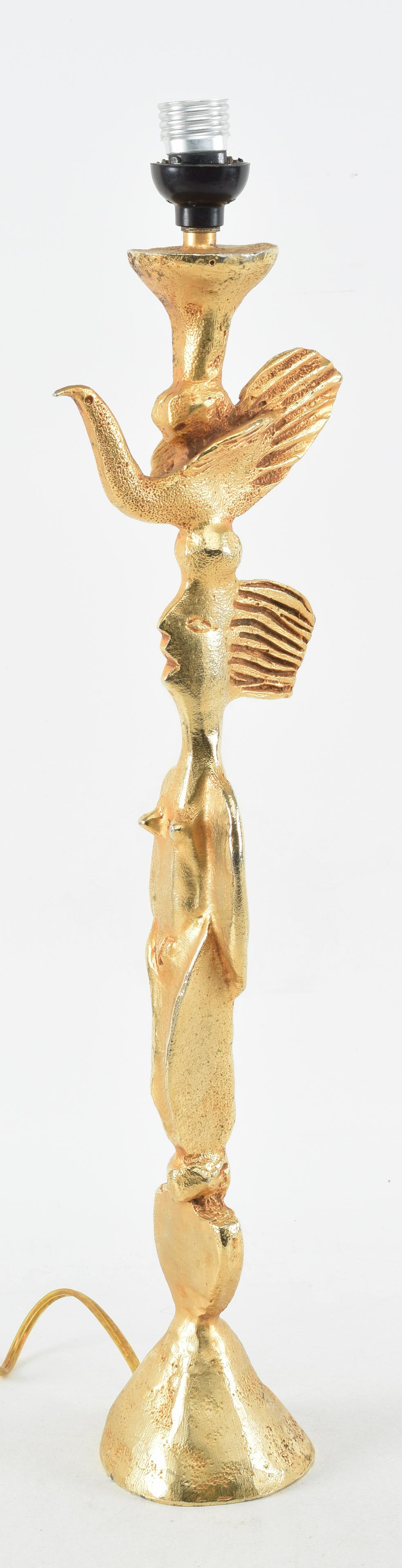 Pierre Casenove modernist table lamp for Fondica, France. Cast and gilded in female form with bird: Pierre Casenove modernist table lamp for Fondica, France. Cast and gilded in female form with bird atop her head. Impressed mark at base. Height without font 20 in.
