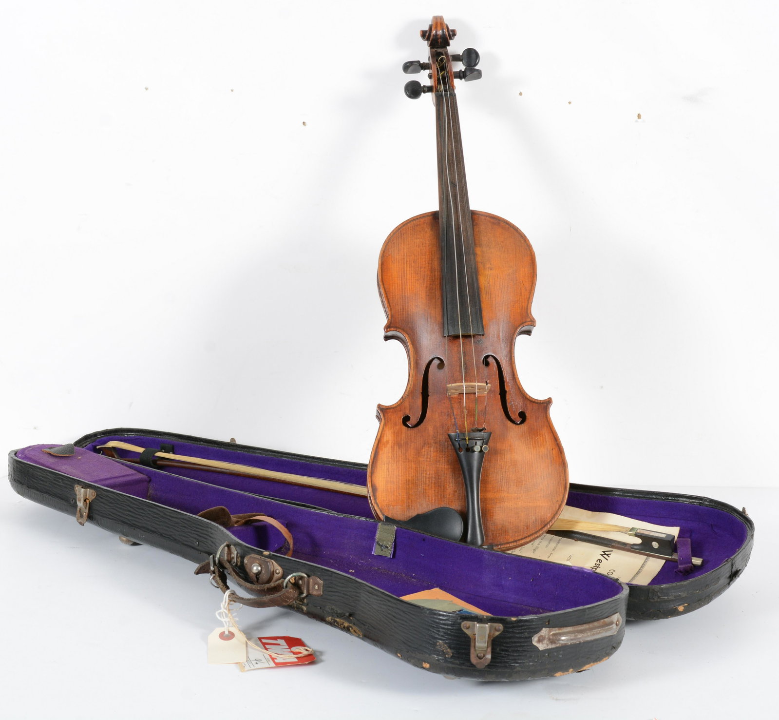 Antique violin and bow. Cased. 2 piece back. Loss to edges. Overall length 23.375in. Unmarked bow.: Antique violin and bow. Cased. 2 piece back. Loss to edges. Overall length 23.375in. Unmarked bow.