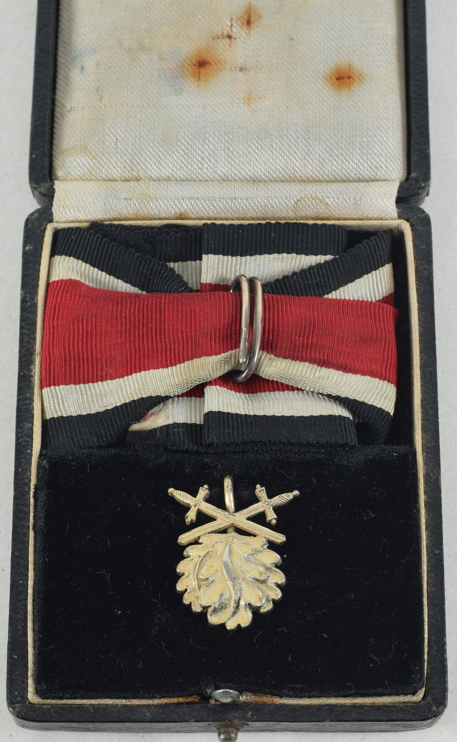 German WWII Era Cased Silver Iron Cross Oak Leaves with Swords. This exceptional item has cast marks: German WWII Era Cased Silver Iron Cross Oak Leaves with Swords. This exceptional item has cast marks to the reverse of "800 / L12" being made by C.E. Juncker who was the only maker who used raised cas