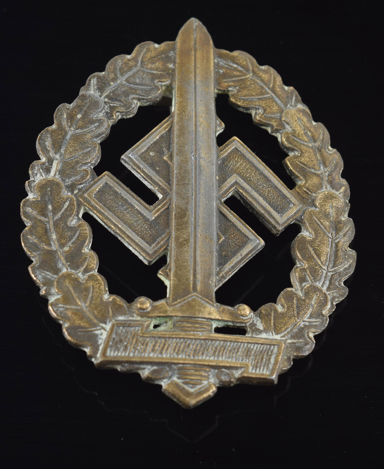 German WWII SA War Wounded Disabled Sport Badge. This is a scarce RZM political version of the Sport: German WWII SA War Wounded Disabled Sport Badge. This is a scarce RZM political version of the Sport Badge for the non qualified disabled. It is maker marked "M1 / 100" by Werner Redo Saarlautern and 