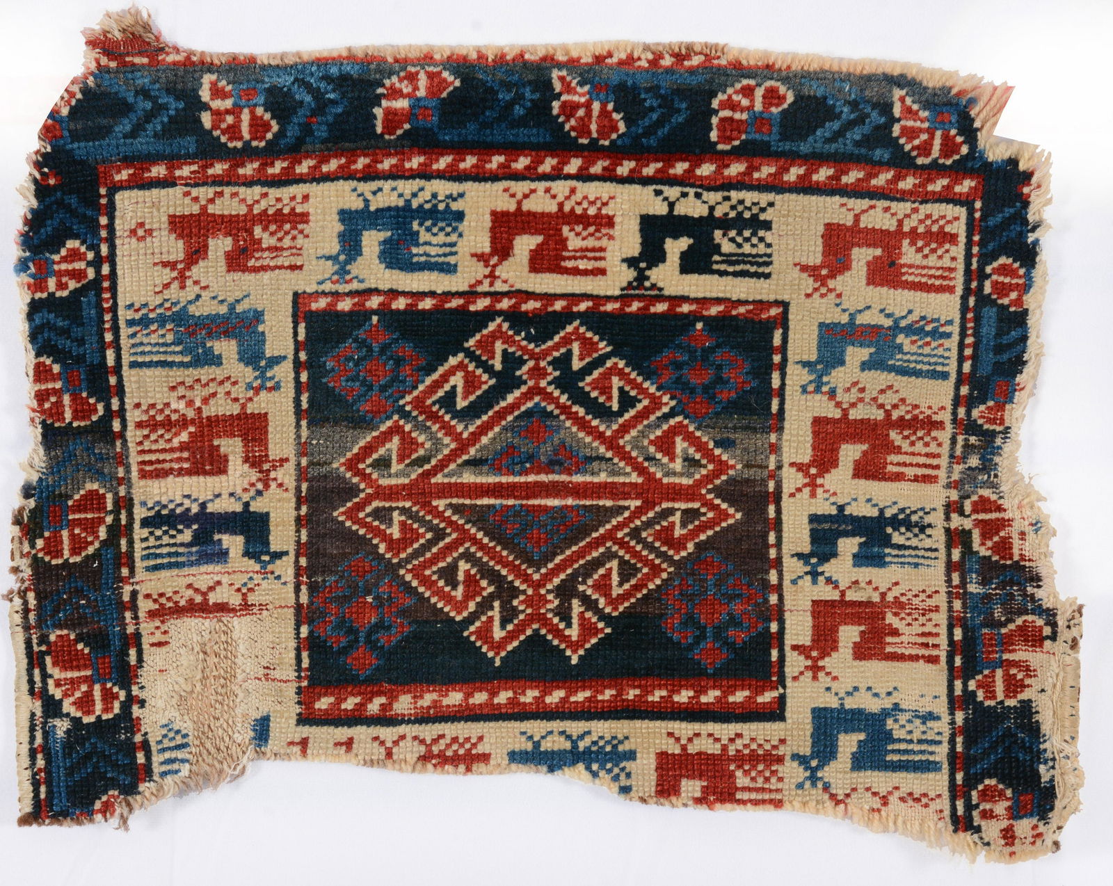 Kuba Mat Fragment, Caucasus, ca. 1900 1 ft. 7 i n. x 1 ft. 2 in. Provenance: The George Gilmore (1 of 3)
