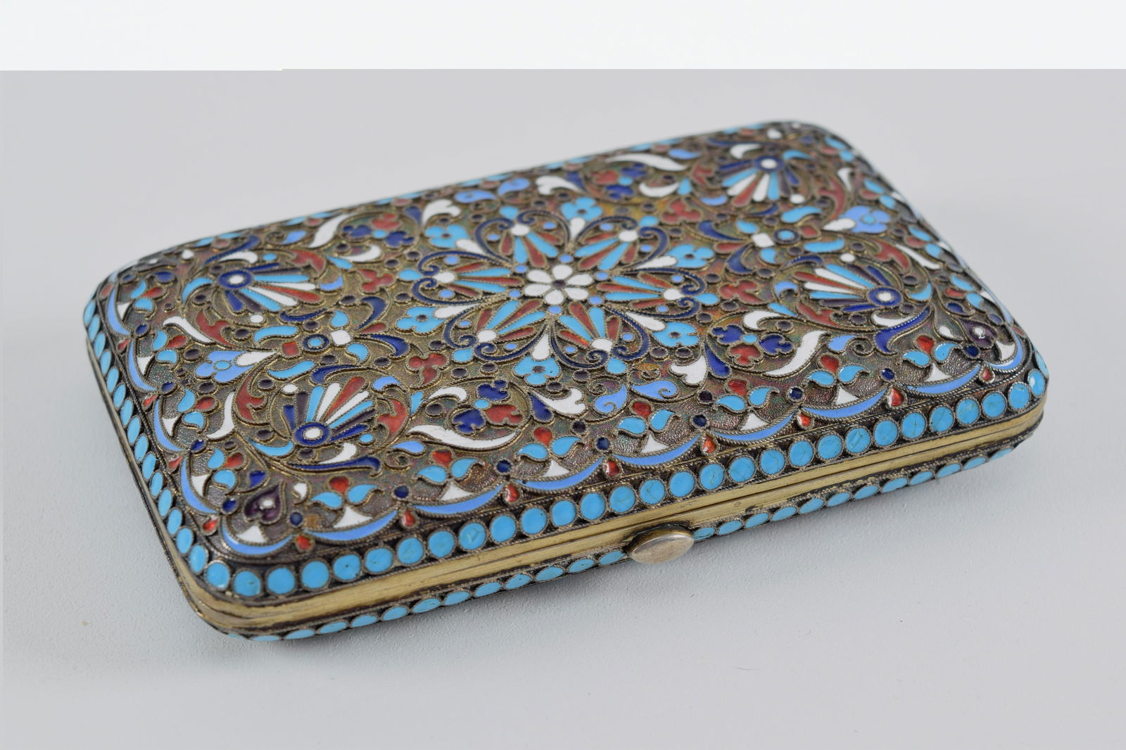 Late 19th/early 20th century Russian silver enamel cigarette case. Relief scrollwork decoration with (1 of 9)