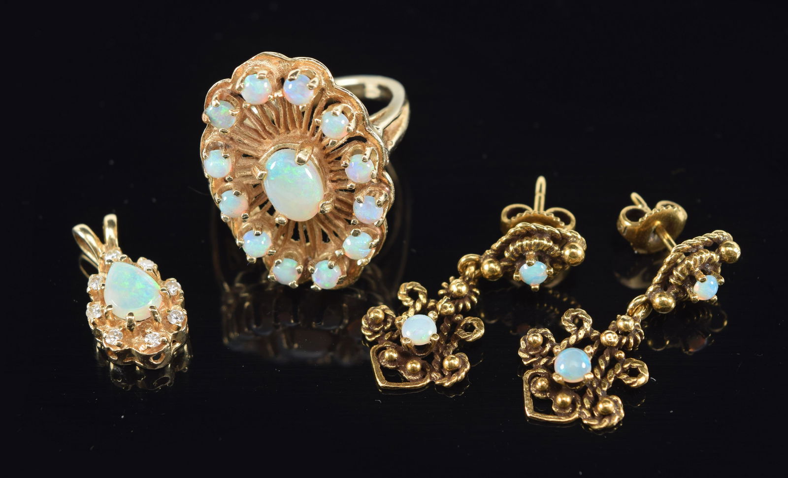 Lot of gold opal jewelry. 1) 14K gold tested opal cluster ring. Size 6.75. 2) Marked 14K opal drop e (1 of 7)