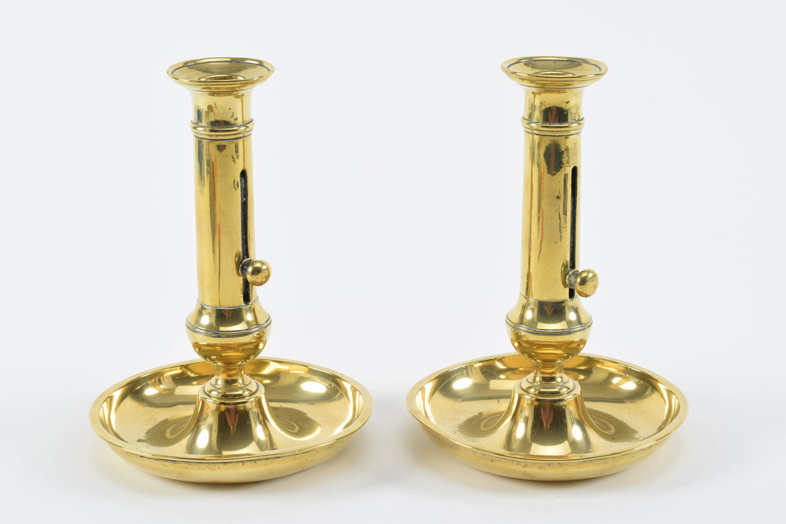 Pair of fine 18th Century brass push-up candlesticks with saucer bases. Height 7.5in (1 of 5)