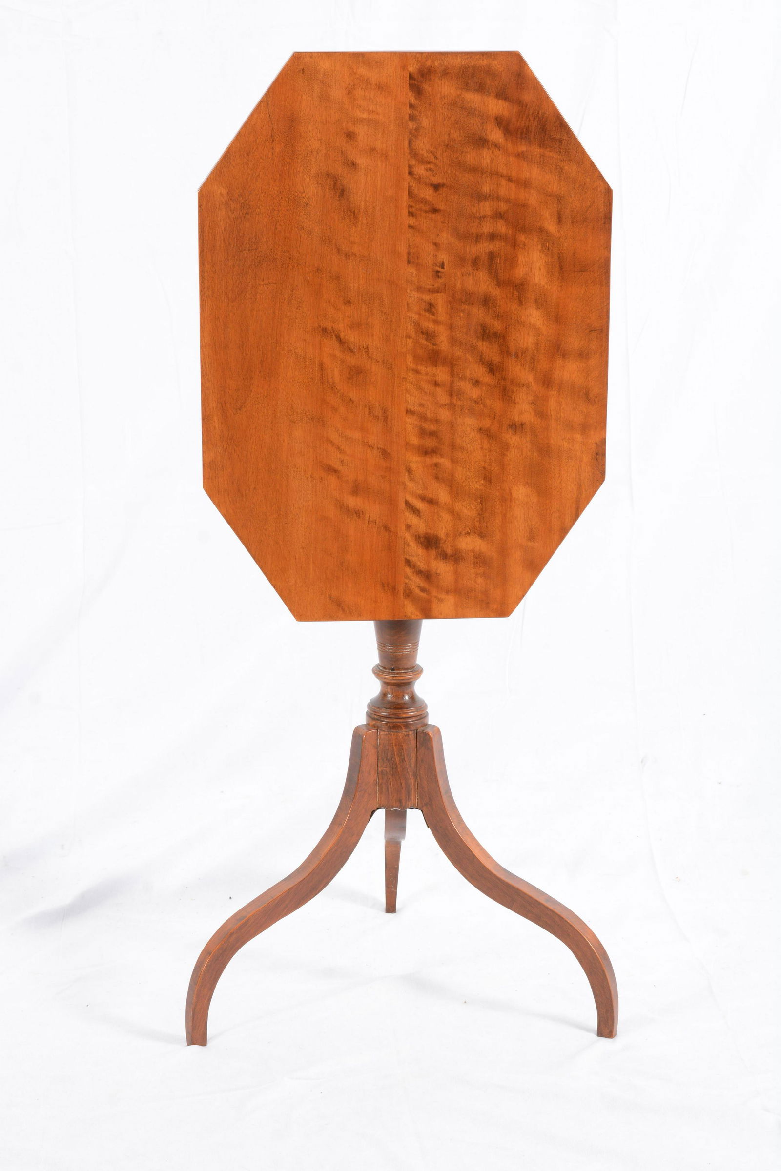 Hepplewhite birch tip top candlestand, New Hampshire circa 1790. Octagonal top with flame birch, (1 of 5)