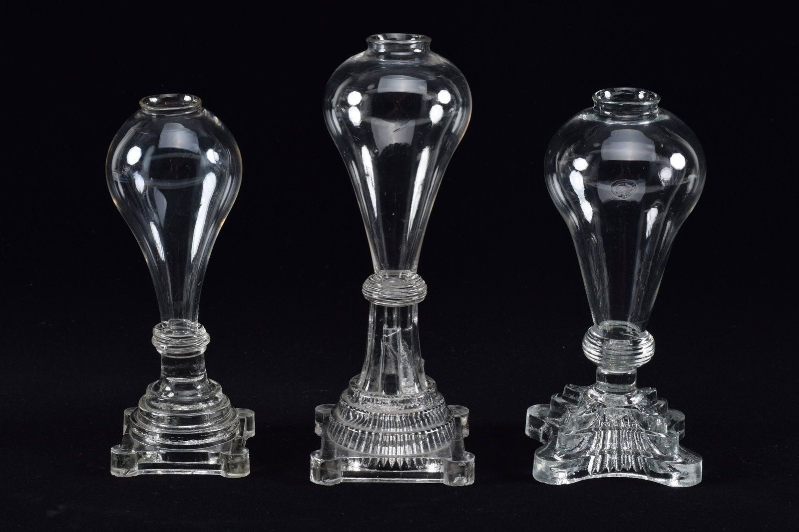 3 American glass whale oil lamps, mid 19th Century. Blown bulb-form fonts some with wafer ring. No: 3 American glass whale oil lamps, mid 19th Century. Blown bulb-form fonts some with wafer ring. No burners. Tallest height 9in