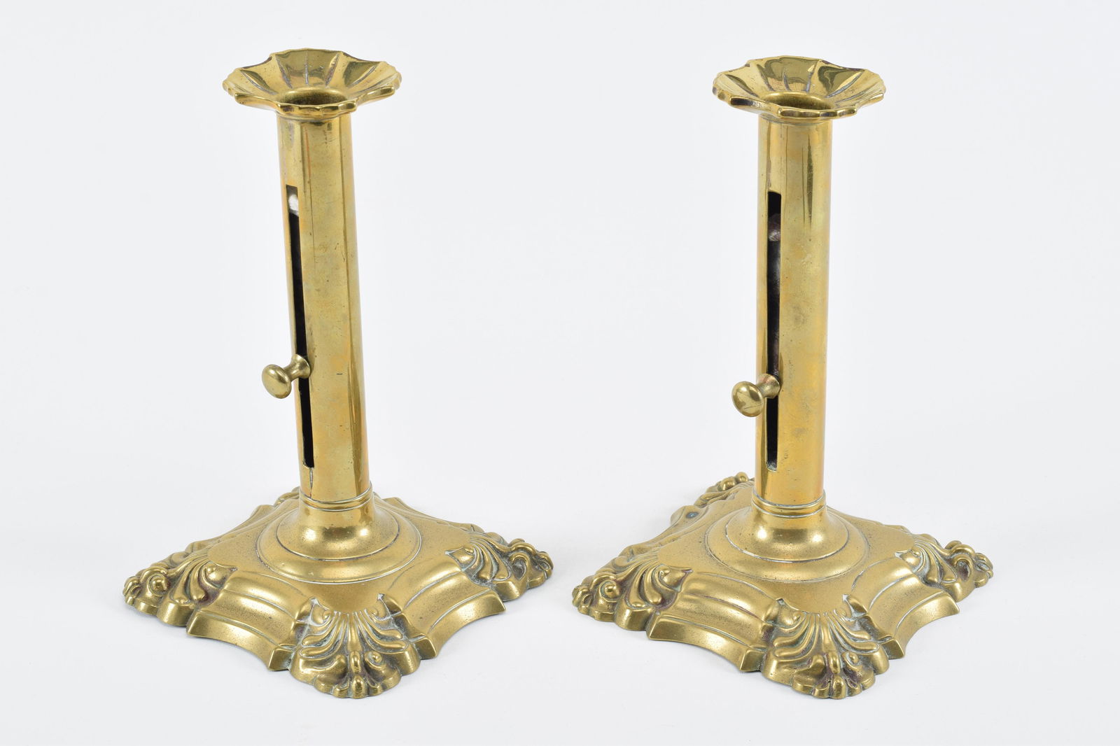 Pair of Chippendale brass push-up candlesticks with gadroon bases, 18th Century. Height 8.25in (1 of 8)