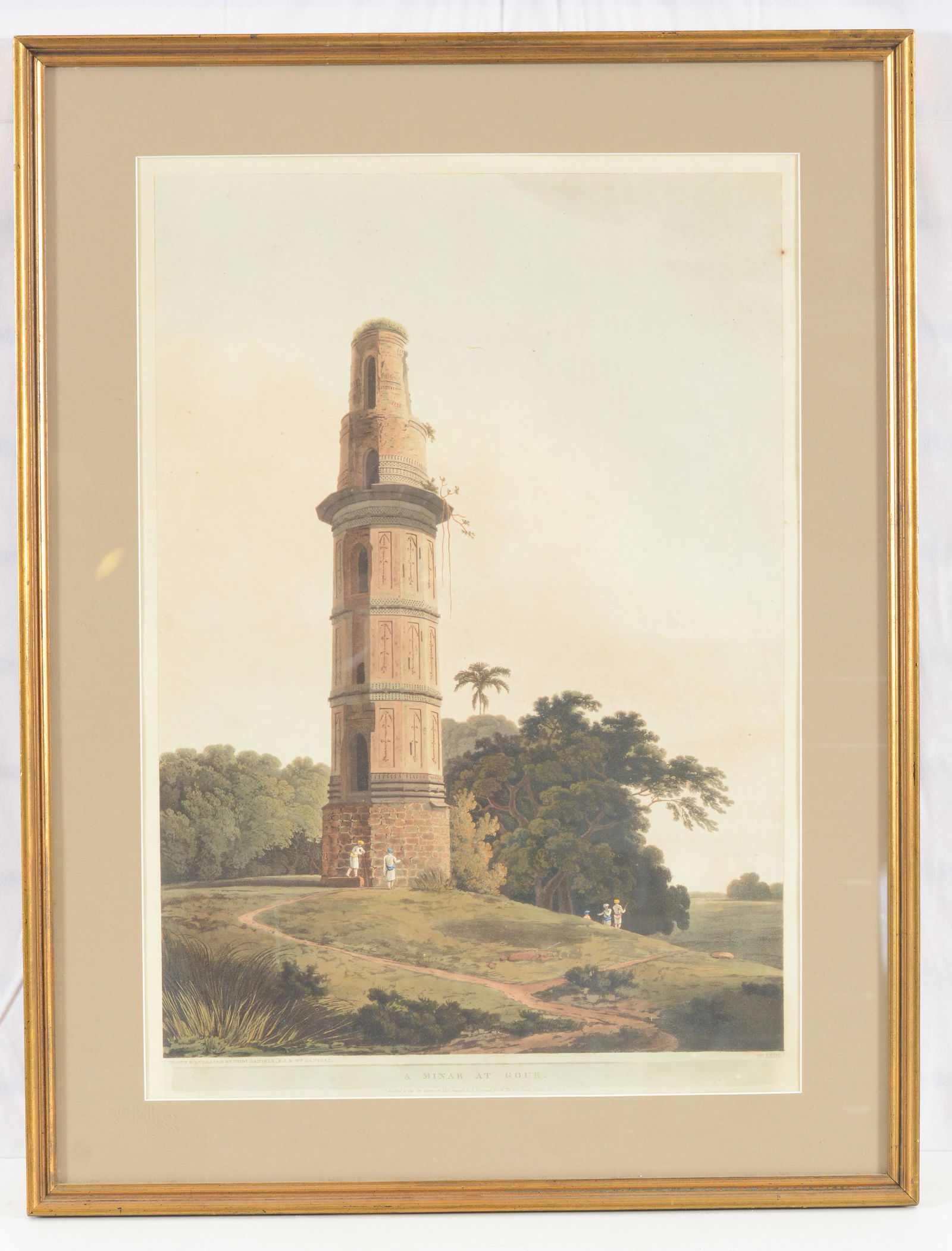 Thomas Daniell. "A Minar at Gour". Original 1808 colored etching depicting a minaret with several: Thomas Daniell. "A Minar at Gour". Original 1808 colored etching depicting a minaret with several figures nearby. Drawn and engraved by Thomas Daniell and William Daniell. Plate no. XXIII. Dark spot o