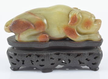 Jade carving. Study of a resting hound. China. Ming period (1368-1644) or earlier. Yellow jade with