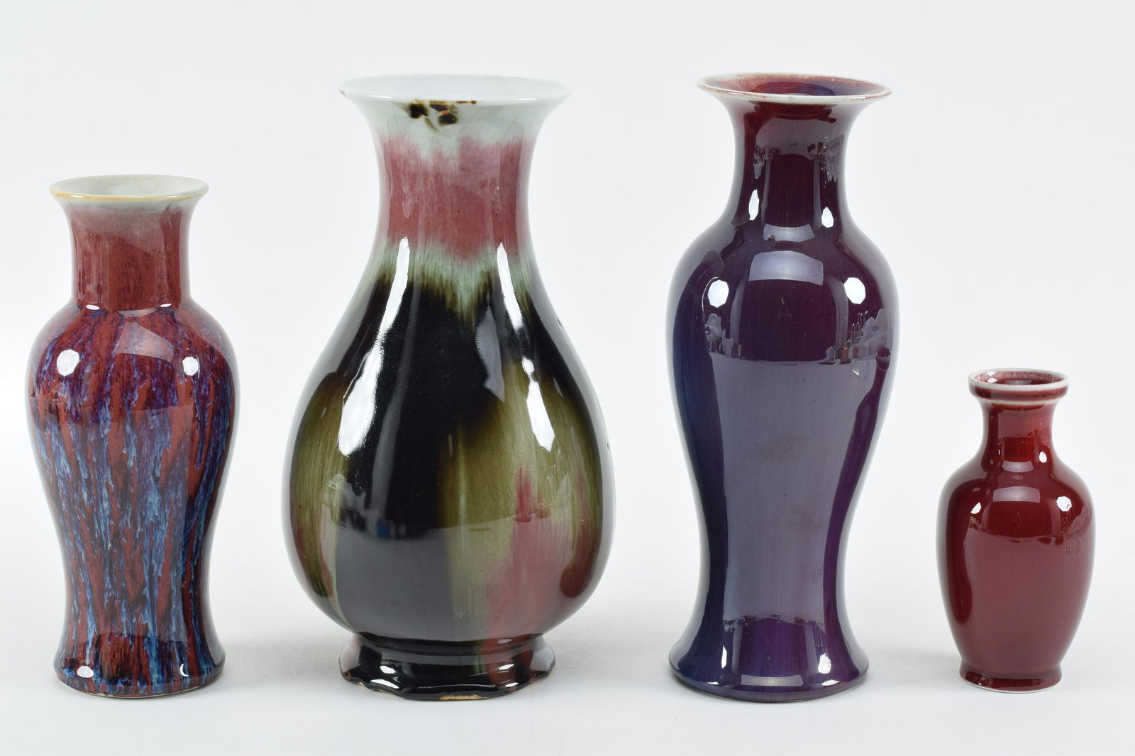 4 porcelain vases. China. 20th century. Lang Yao flambe surfaces. Tallest 10.5in. (1 of 13)