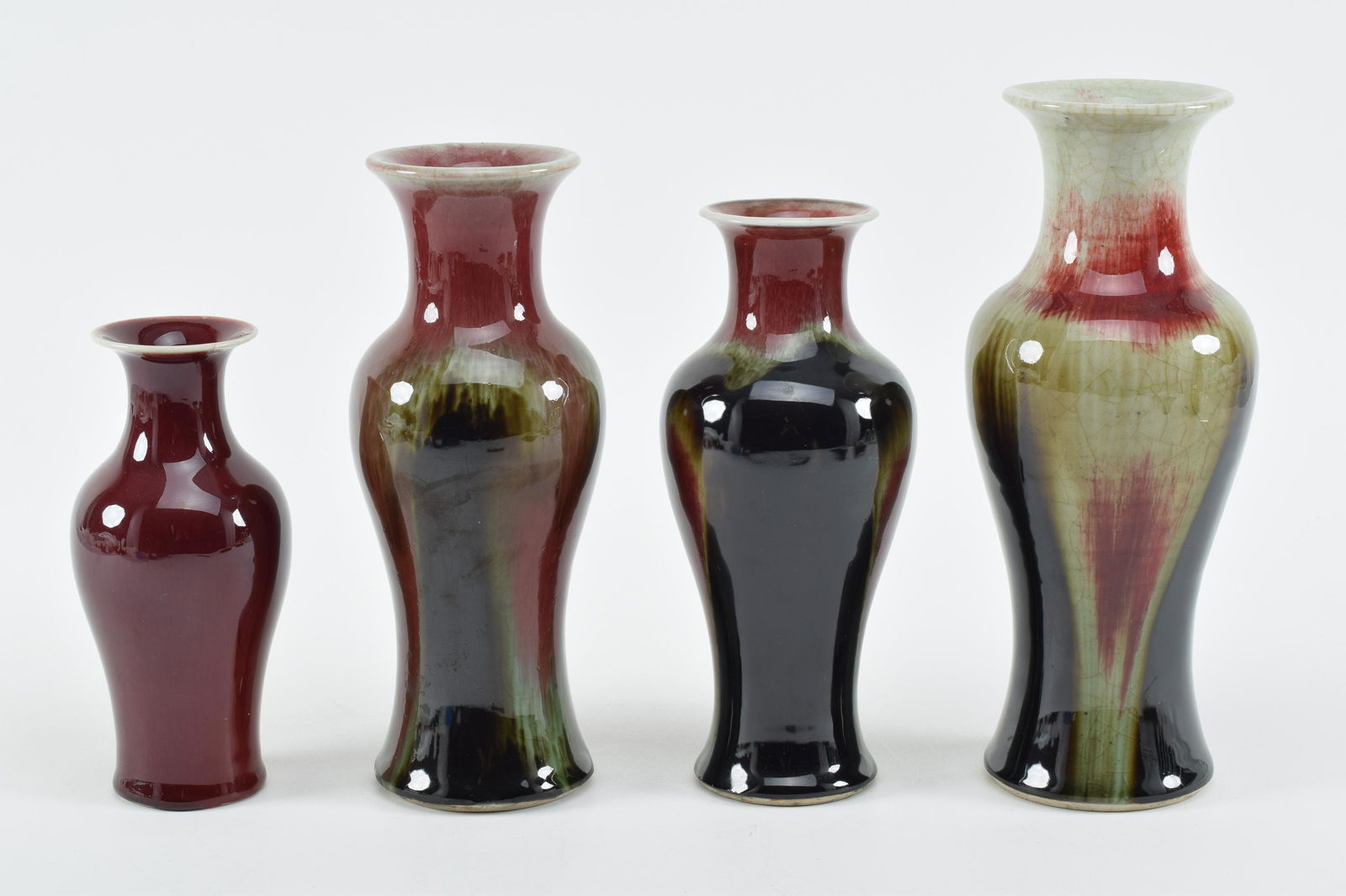 4 porcelain vases. China. 20th century. Lang Yao flambe surfaces. Tallest 10in. (1 of 12)
