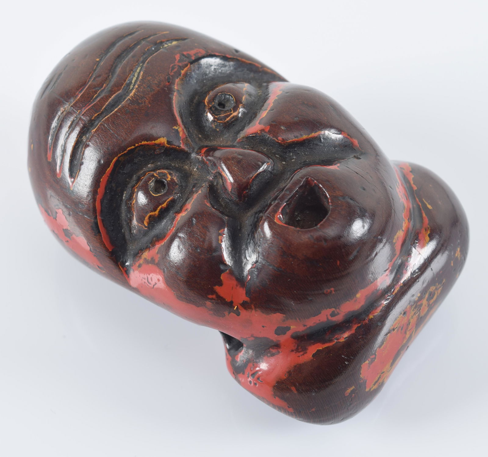 Wooden netsuke. Japan. 19th century. Carved as 2 masks. Black and red lacquer surface. 2.5in L. (1 of 3)