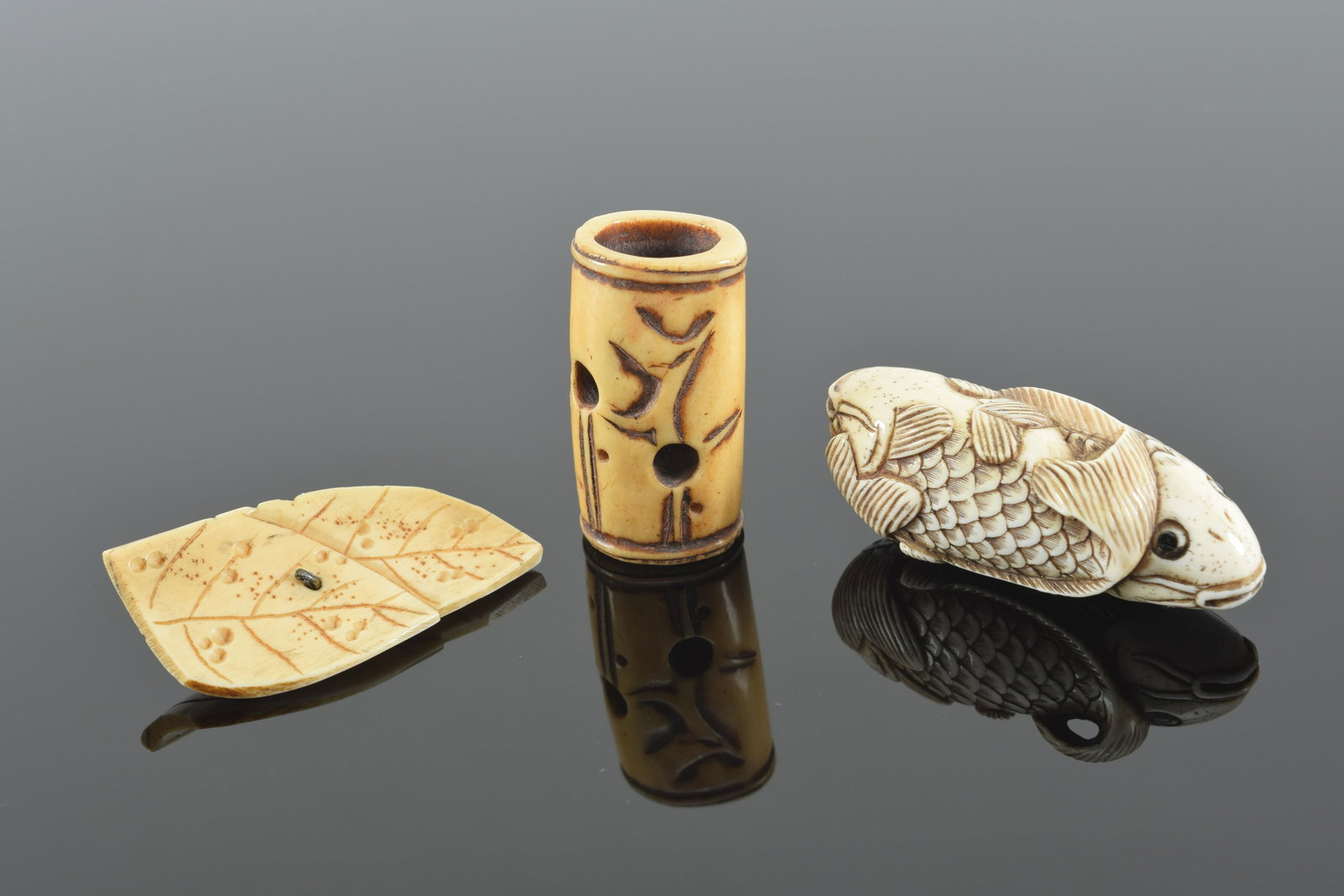 3 bone netsuke. Japan. 19th/20th century. One of a double fish. Largest 2in. Provenance: From the: 3 bone netsuke. Japan. 19th/20th century. One of a double fish. Largest 2in. Provenance: From the collection of Donald Snow.