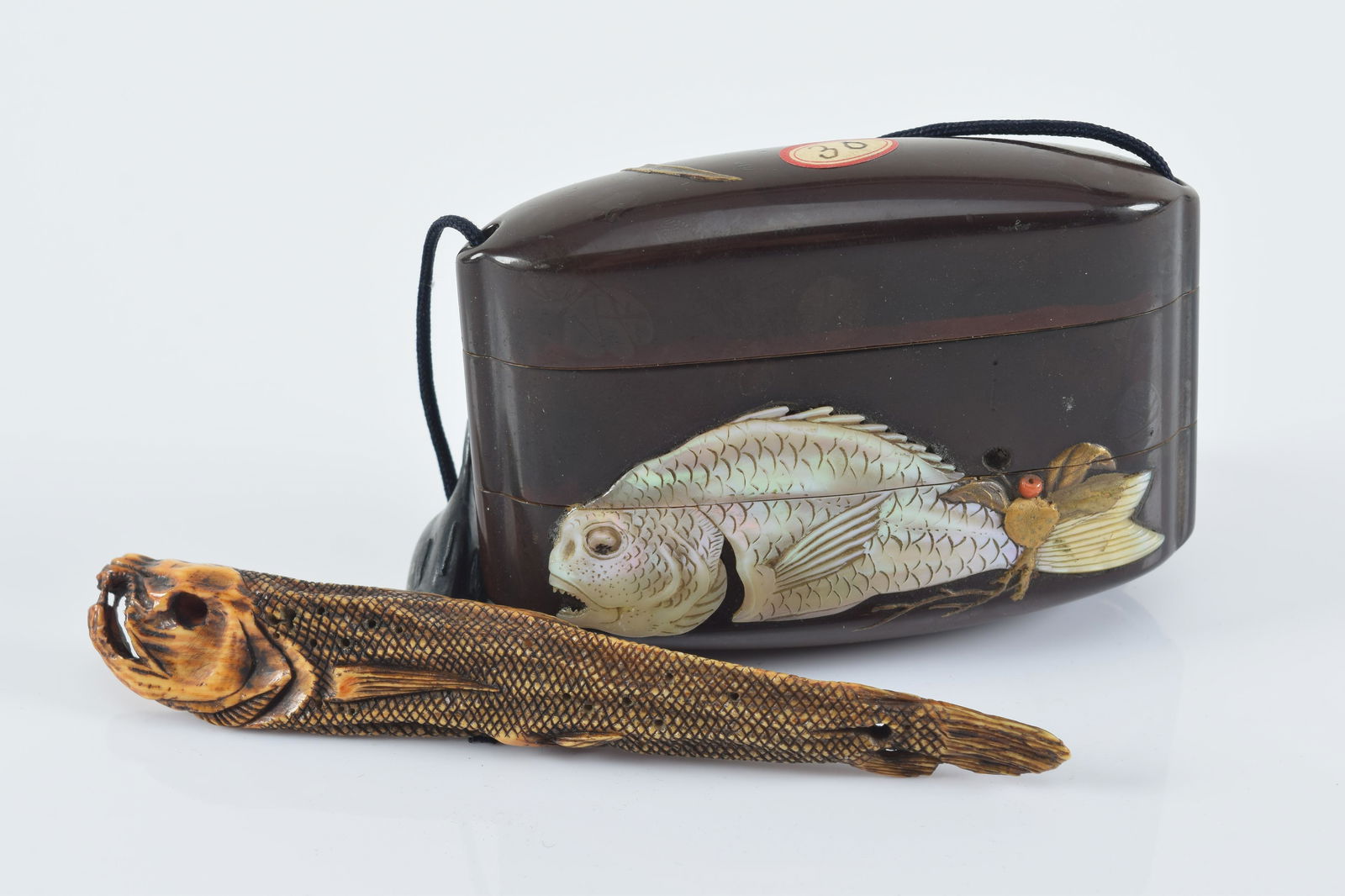 Sagemono. Japan. 19th century. Inro of black lacquer inlaid with a fish. (1 of 8)
