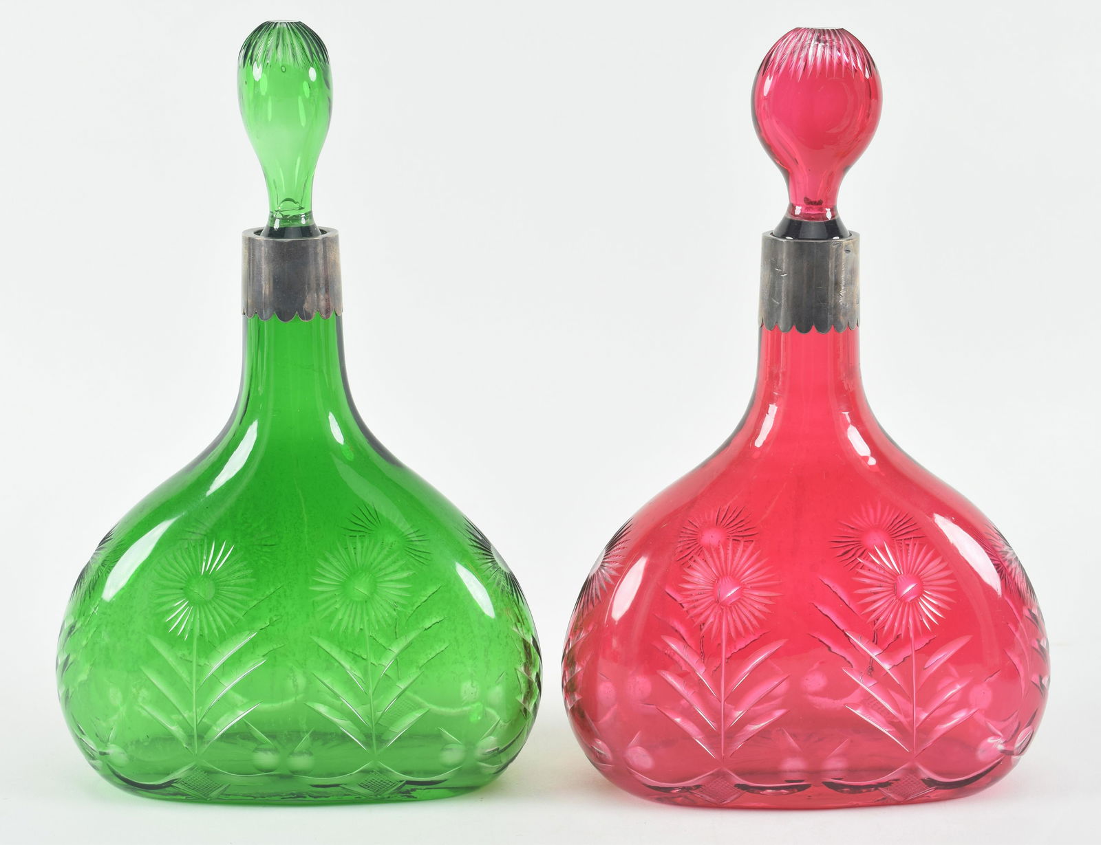 Pair of crystal decanters with sterling silver collars. One green and one red flashed. Each with (1 of 13)