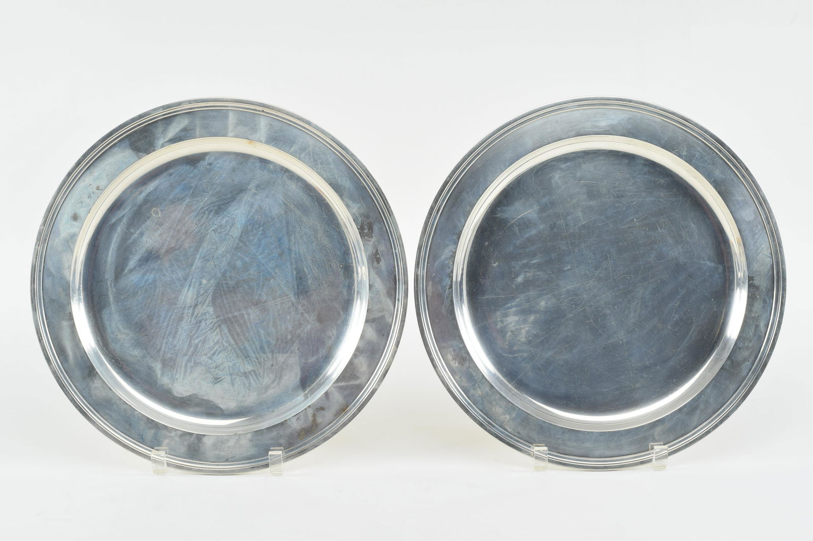Pair of Tiffany & Co. sterling silver chargers. Early/mid 20th century. 13in diameter. 61.8 ozt. (1 of 7)