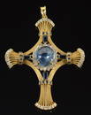 14K gold ornate sapphire and diamond mounted cross form pendant. Open wire work design. Large