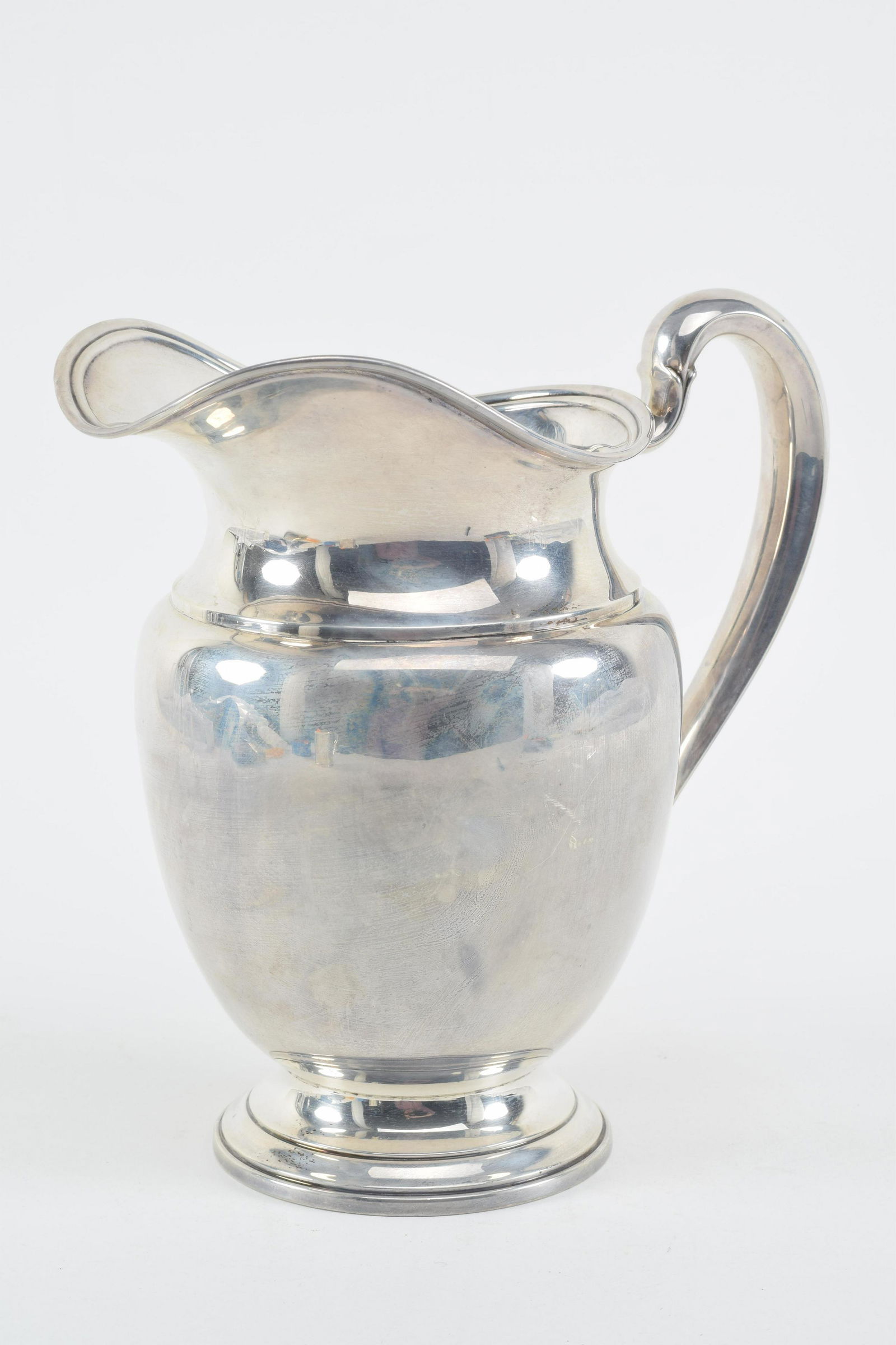International sterling silver water pitcher. 9in high. 19.5 ozt. (1 of 5)