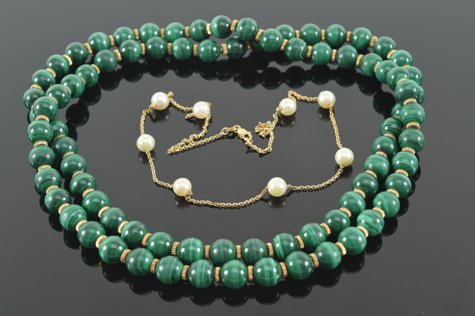 14K Gold and cultured pearl necklace; featuring oval links and eight cultured pearls, 8.14 grams.: 14K Gold and cultured pearl necklace; featuring oval links and eight cultured pearls, 8.14 grams. Together with malachite and gold bead necklace