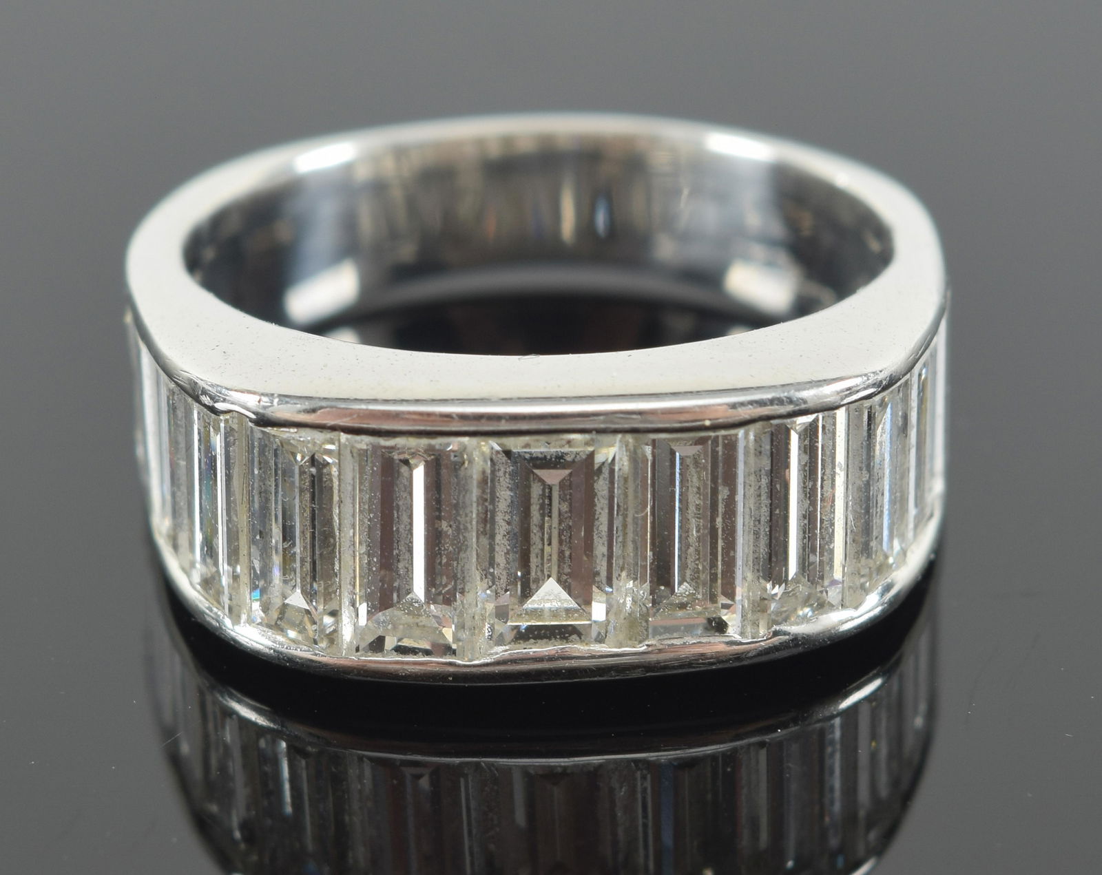 18K gold diamond mounted ring set with 12 large baguette cut diamonds. Approx. 1 CTW plus. Unmarked, (1 of 7)