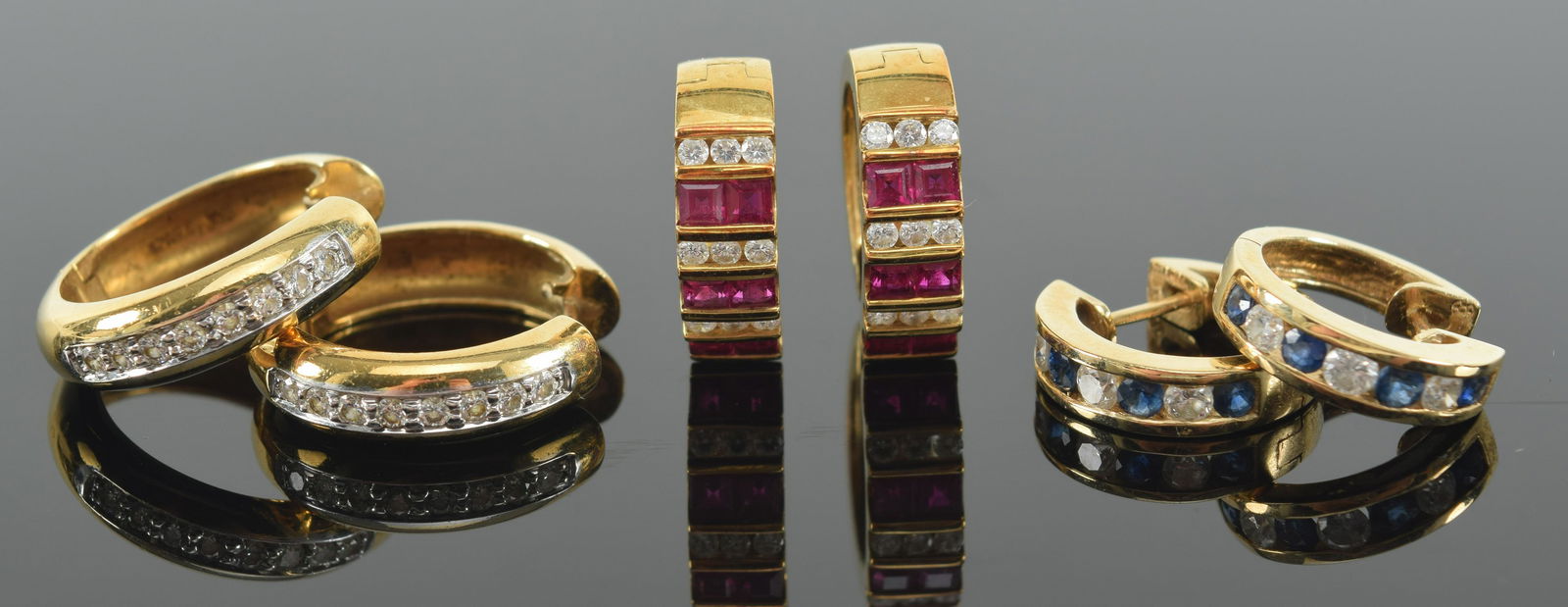 3 Pairs of 18K Gold, diamond, and gemset huggie earrings; one with ruby and diamonds, one with (1 of 7)