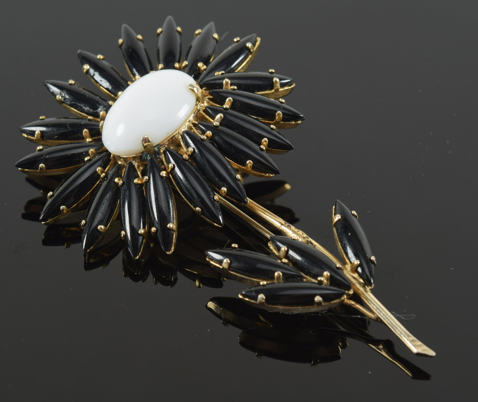 Schreiner floral brooch with black petals around a white center. Marked. Length 3.25in: Schreiner floral brooch with black petals around a white center. Marked. Length 3.25in
