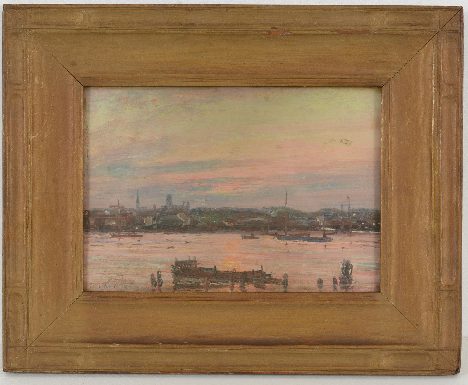 Oscar Anderson. English evening landscape with boats along a canal and city skyline. Titled on: Oscar Anderson. English evening landscape with boats along a canal and city skyline. Titled on reverse. Oil on canvas on board. Framed under glass. Sight: 7 x 10in. Overall: 11.5 x 14.5in.