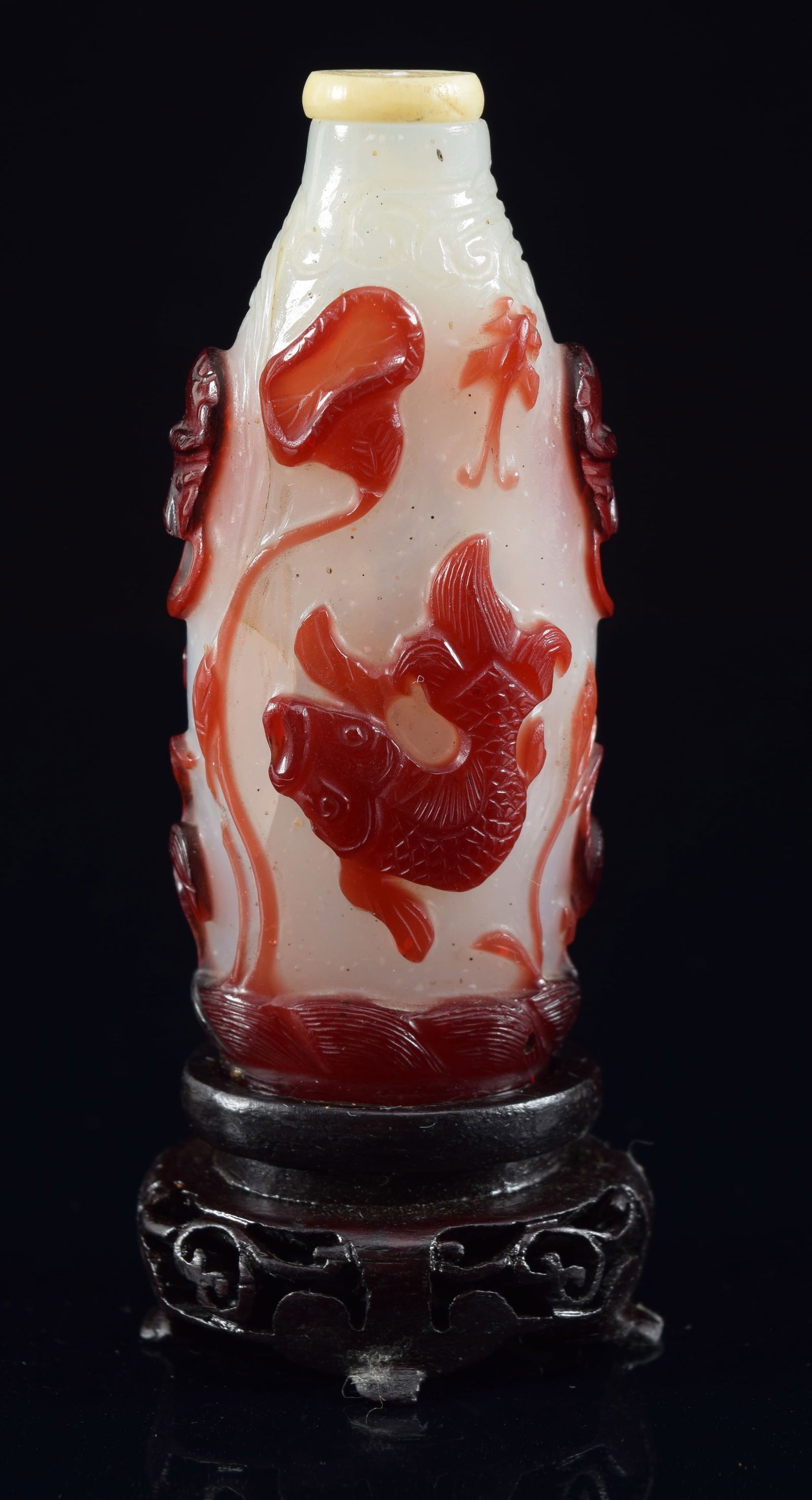 Peking glass snuff bottle. China. 19th century. Red cut to white. Cameo carved with fish, cranes, (1 of 5)