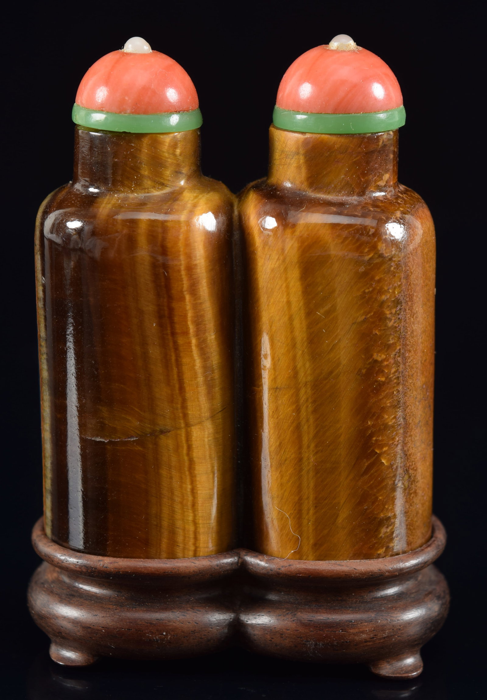 Double snuff bottle. China. 19th century. Tiger eye. Cylindrical shape. Pearl and coral stopper. 2in: Double snuff bottle. China. 19th century. Tiger eye. Cylindrical shape. Pearl and coral stopper. 2in H. Provenance: The Mitchell Bistany Collection.