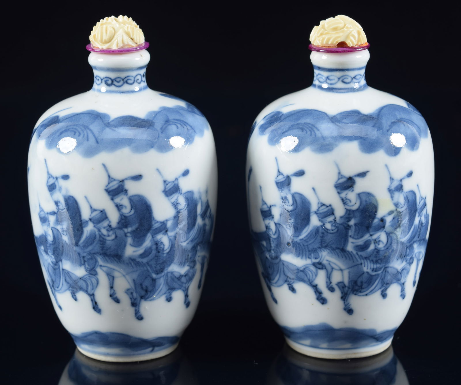 Pair of porcelain snuff bottles. China. 19th century. Underglaze blue decoration of a manchu entry (1 of 6)