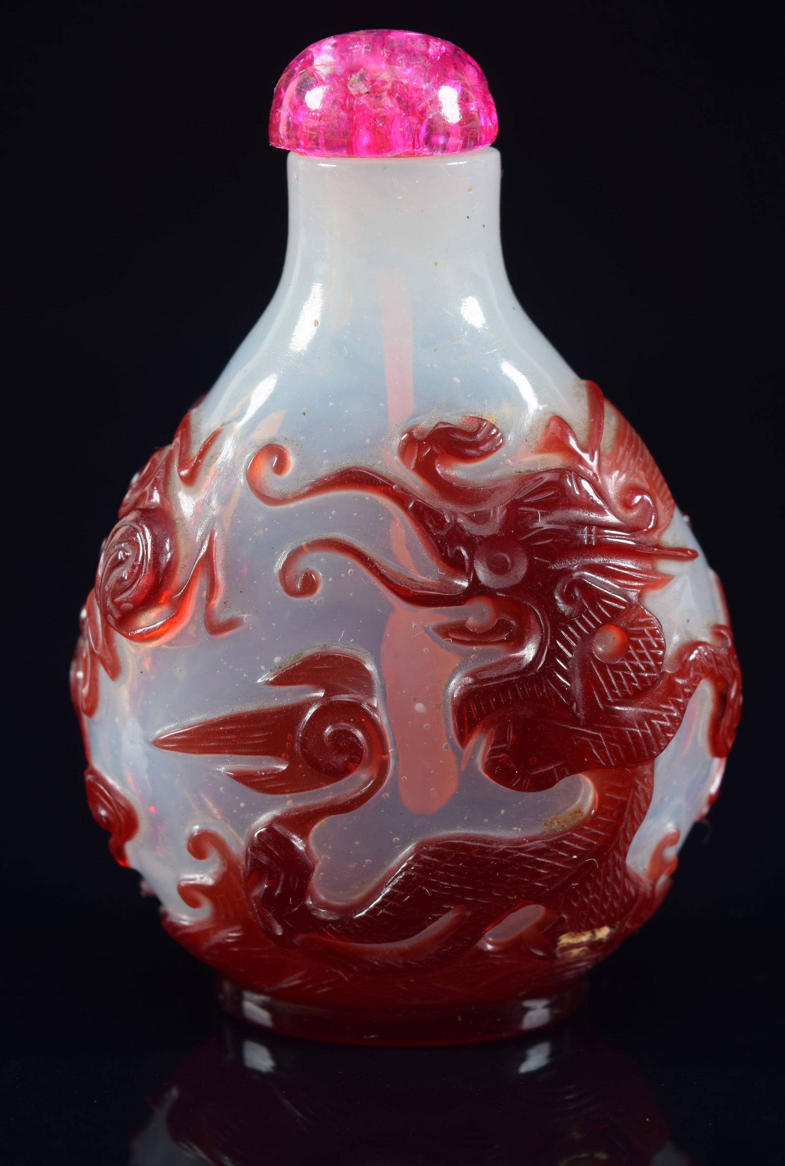Cameo glass snuff bottle. China. 19th century. Ruby cut to opalescent color. Surface carved with a (1 of 6)