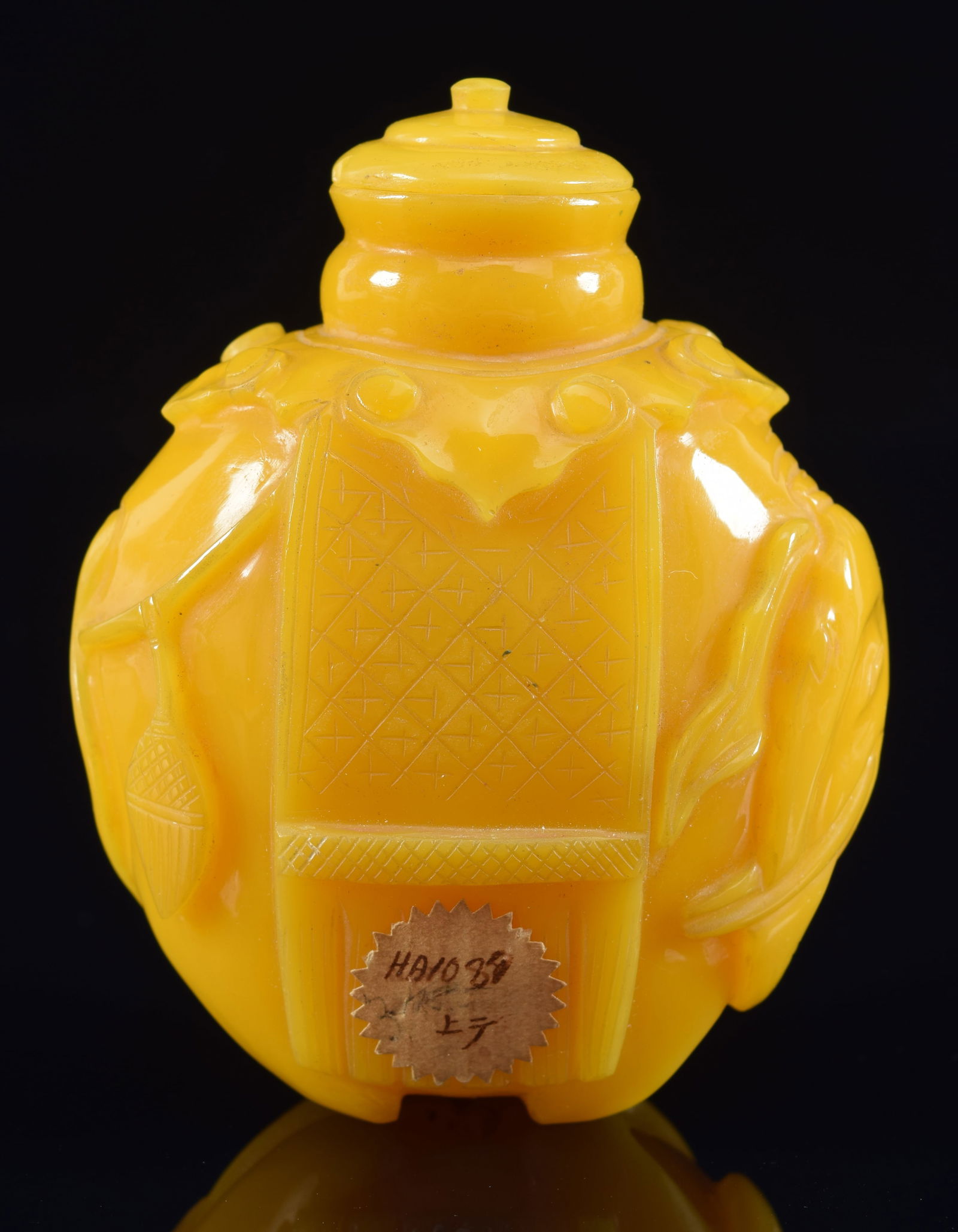 Imperial workshop snuff bottle. China. 19th century. Yellow glass carved as a caparisoned elephant. (1 of 8)